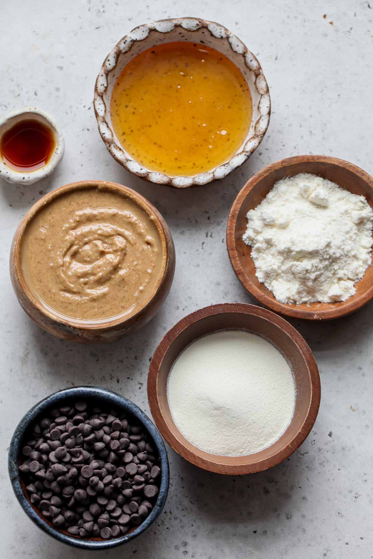 Recipe ingredients in separate bowls on a white board