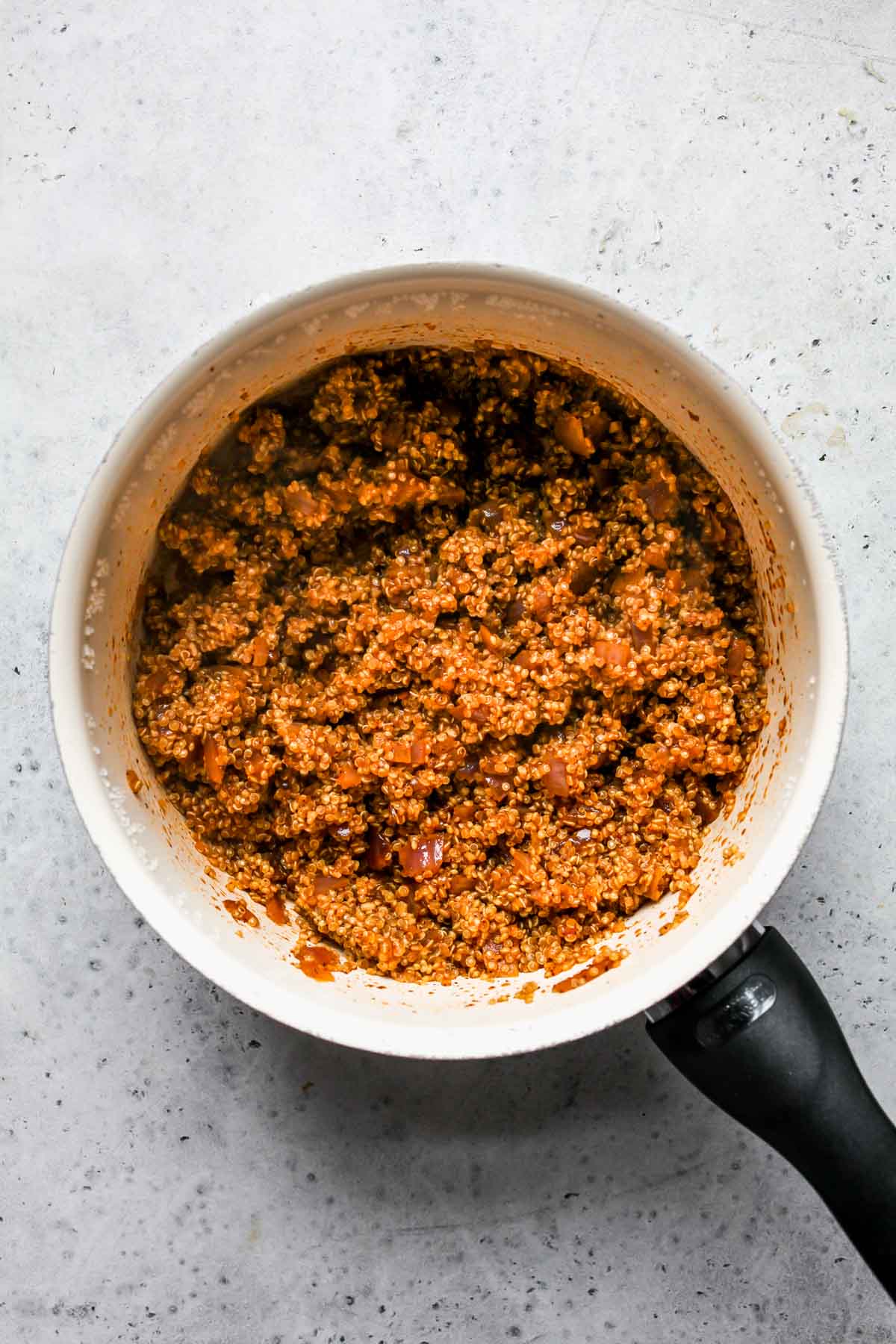 Taco-spiced quinoa cooked in a saucepan