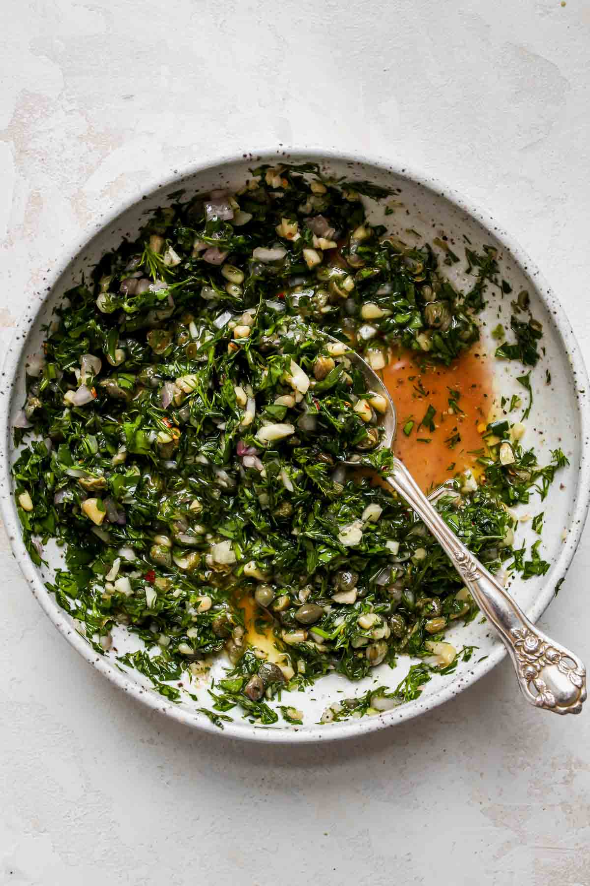 Caper Chimichurri mixed in a white bowl