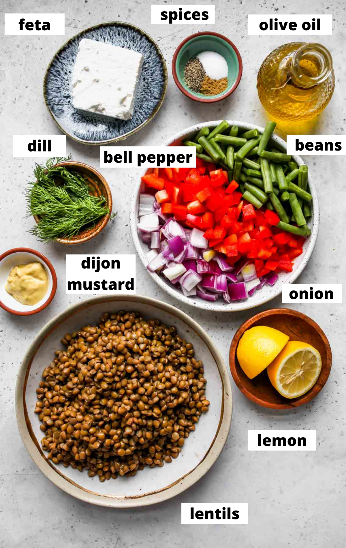 Recipe ingredients in separate bowls on a white board with labels.