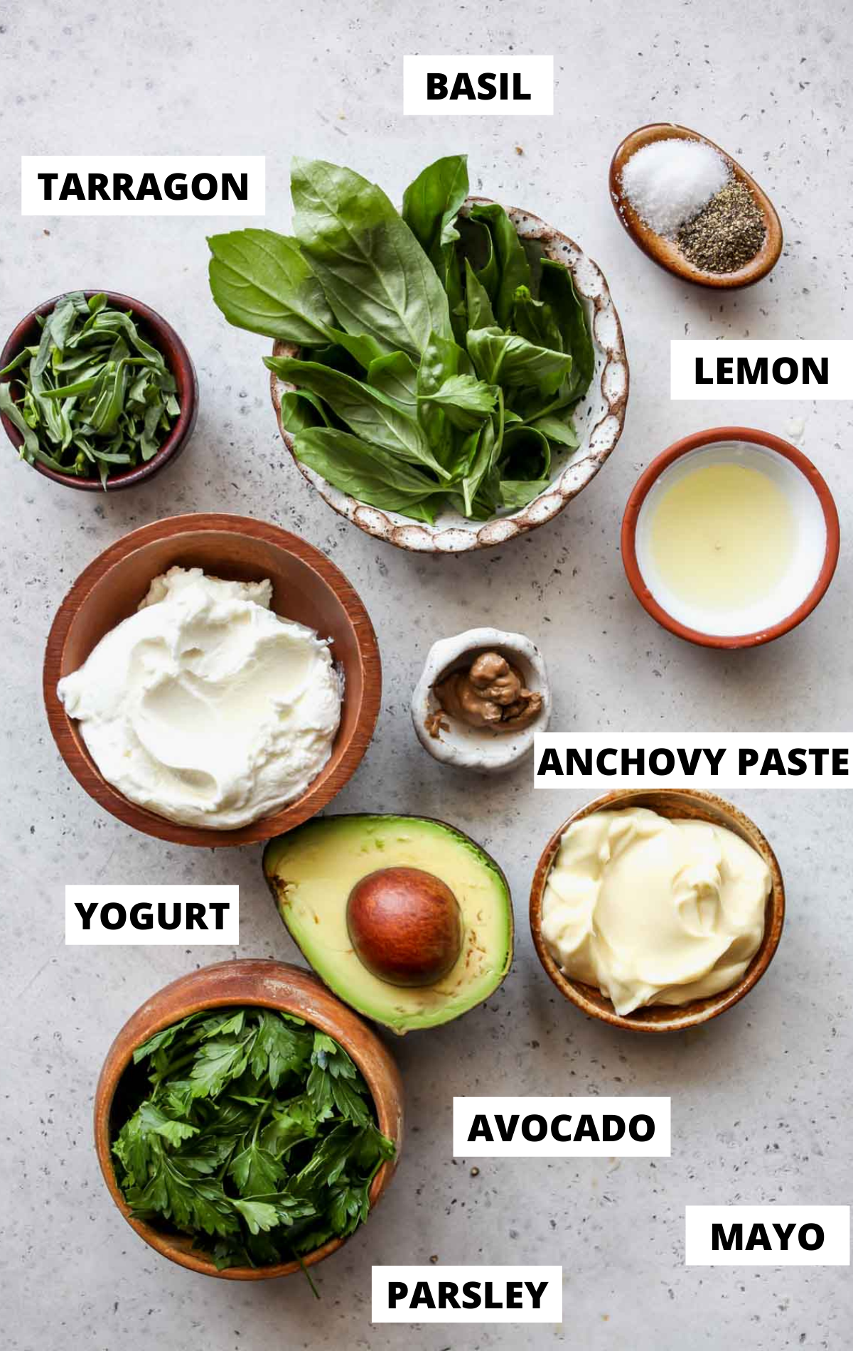 Recipe ingredients in separate bowls on a white board with labels