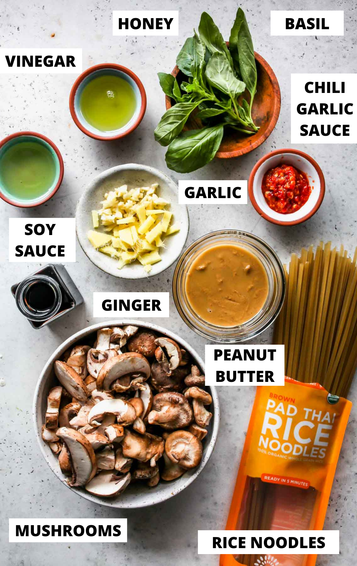Recipe ingredients in separate bowls on a board with labels