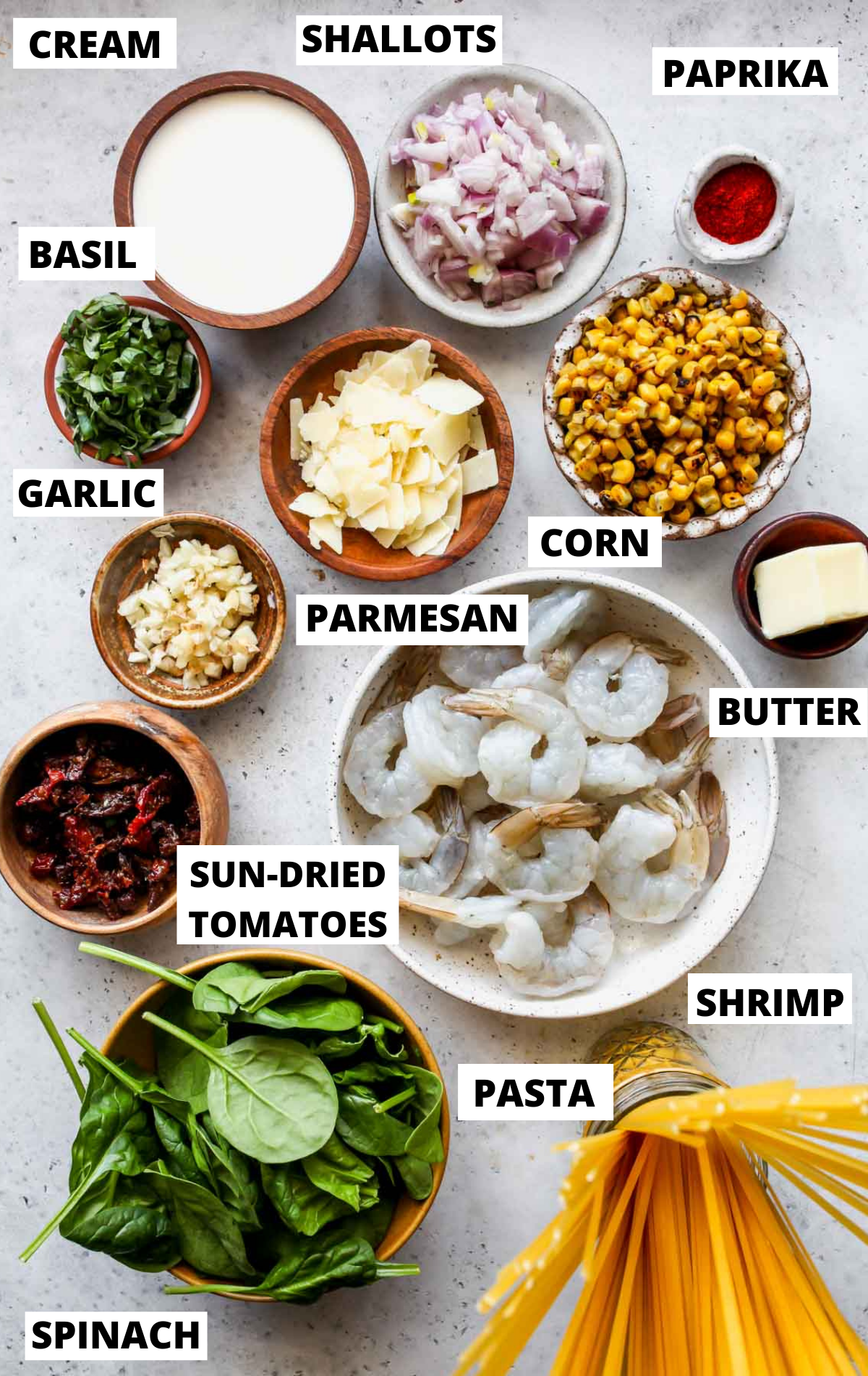 Recipe ingredients in separate bowls with titles