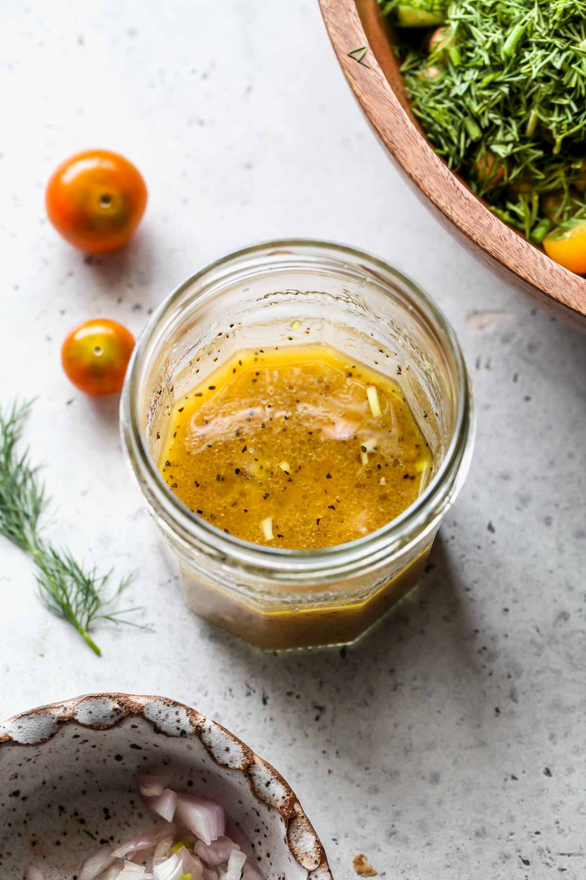 Shallot dressing being mixed in a jar