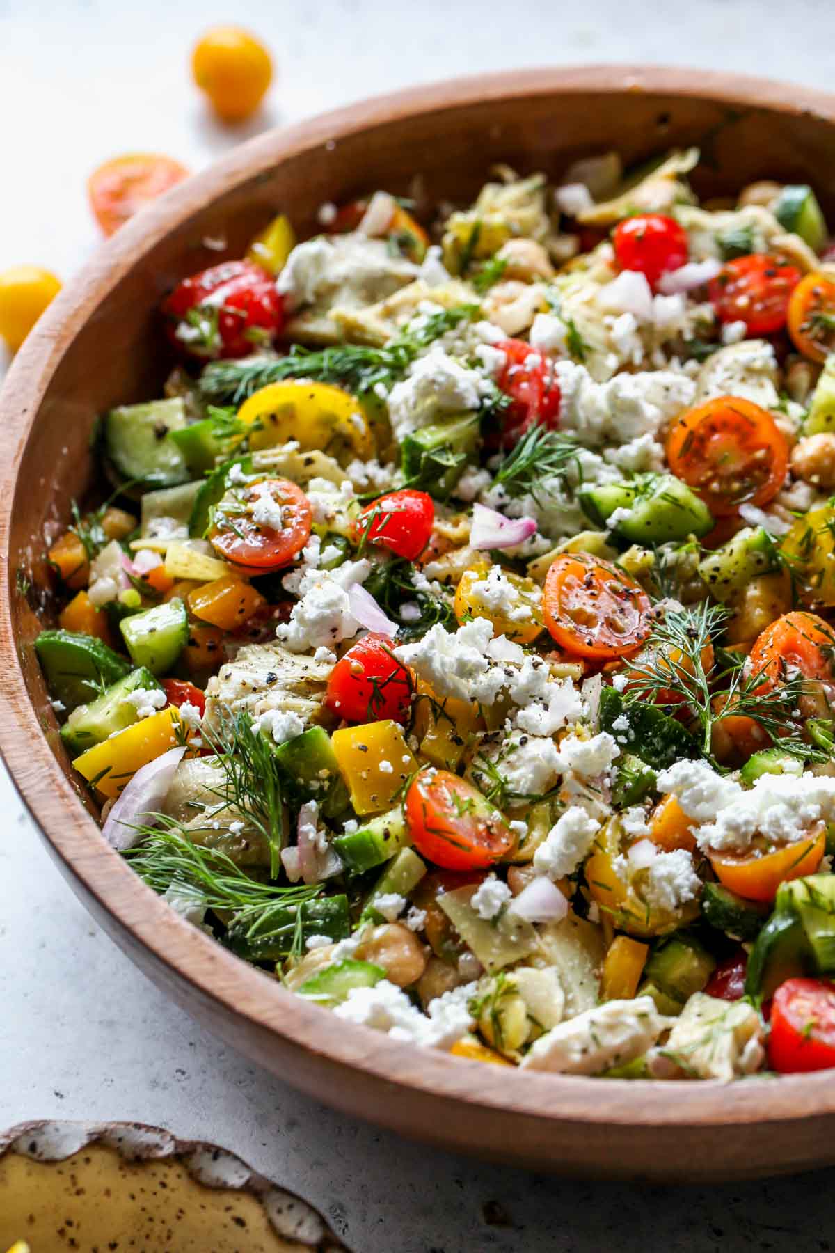 Chickpea salad with shallot dressing and feta mixed in a bowl