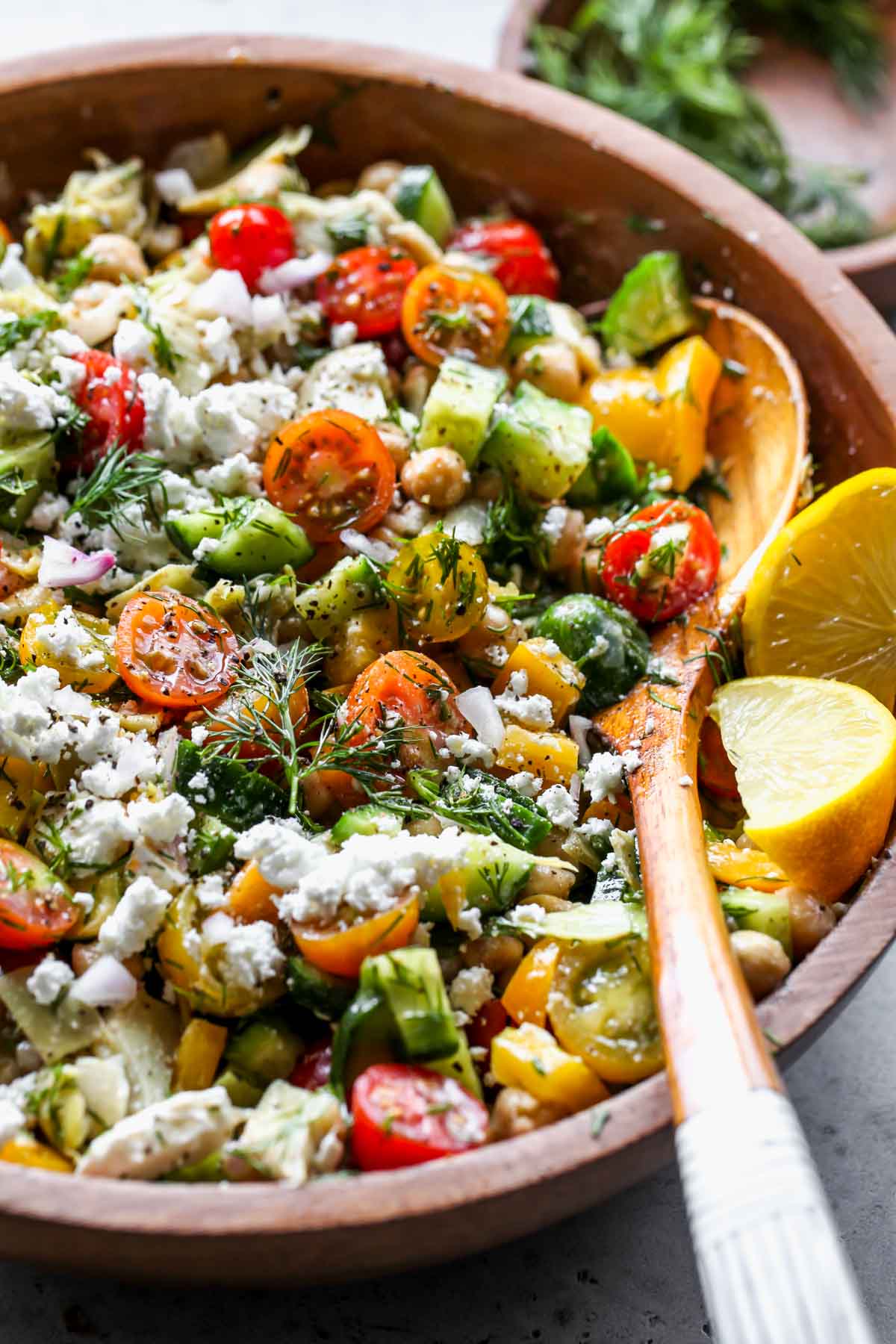 Mediterranean Chickpea Salad assembled in a wooden serving bowl