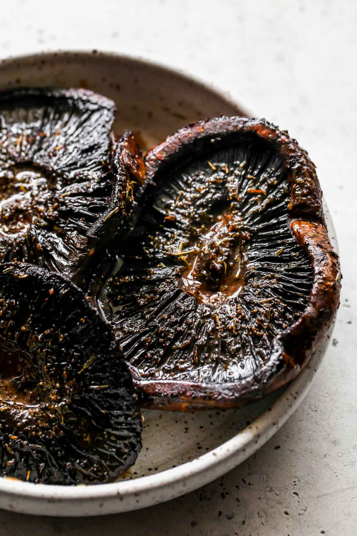 Portobello mushroom caps after being seared and plated