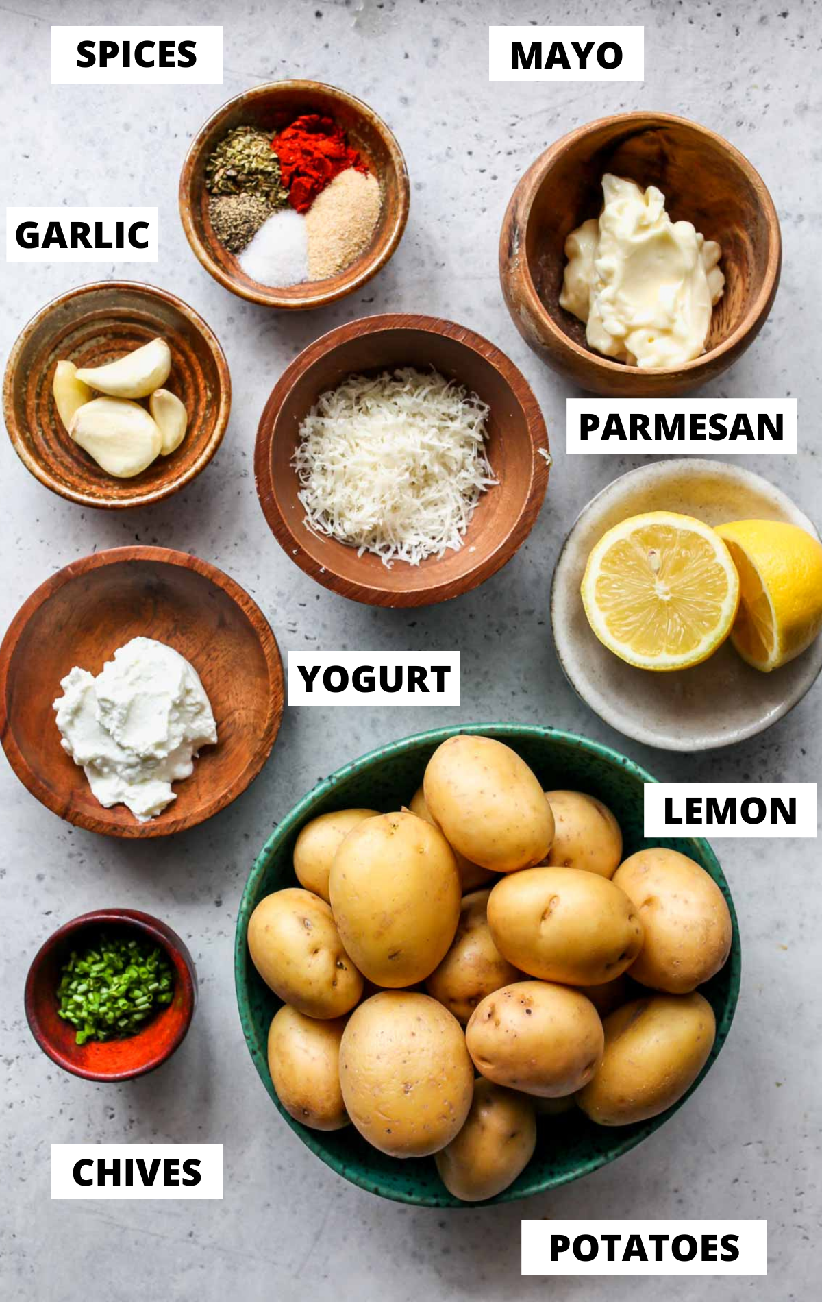 Recipe ingredients in separate bowls on a white board with labels