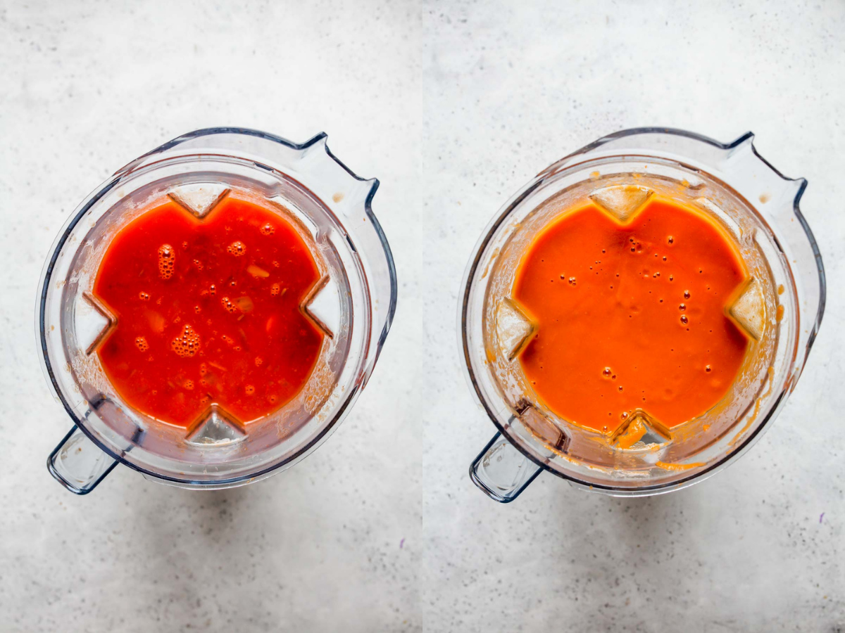 Tomatoes, broth, and aromatics being blended until smooth in a blender.