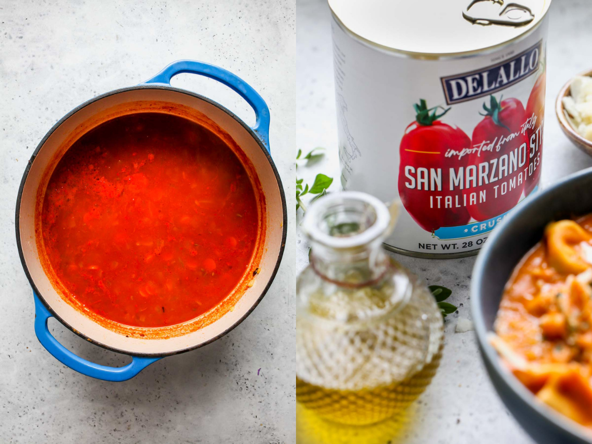 Tomatoes, broth, and aromatics simmering in a large blue and white Dutch oven.