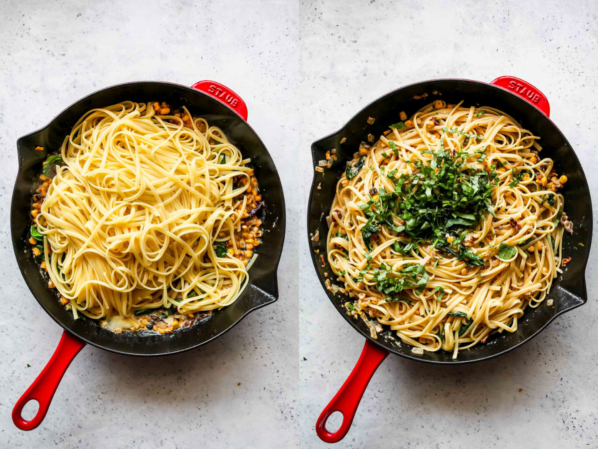 Linguine and basil being added to a skillet of veggies