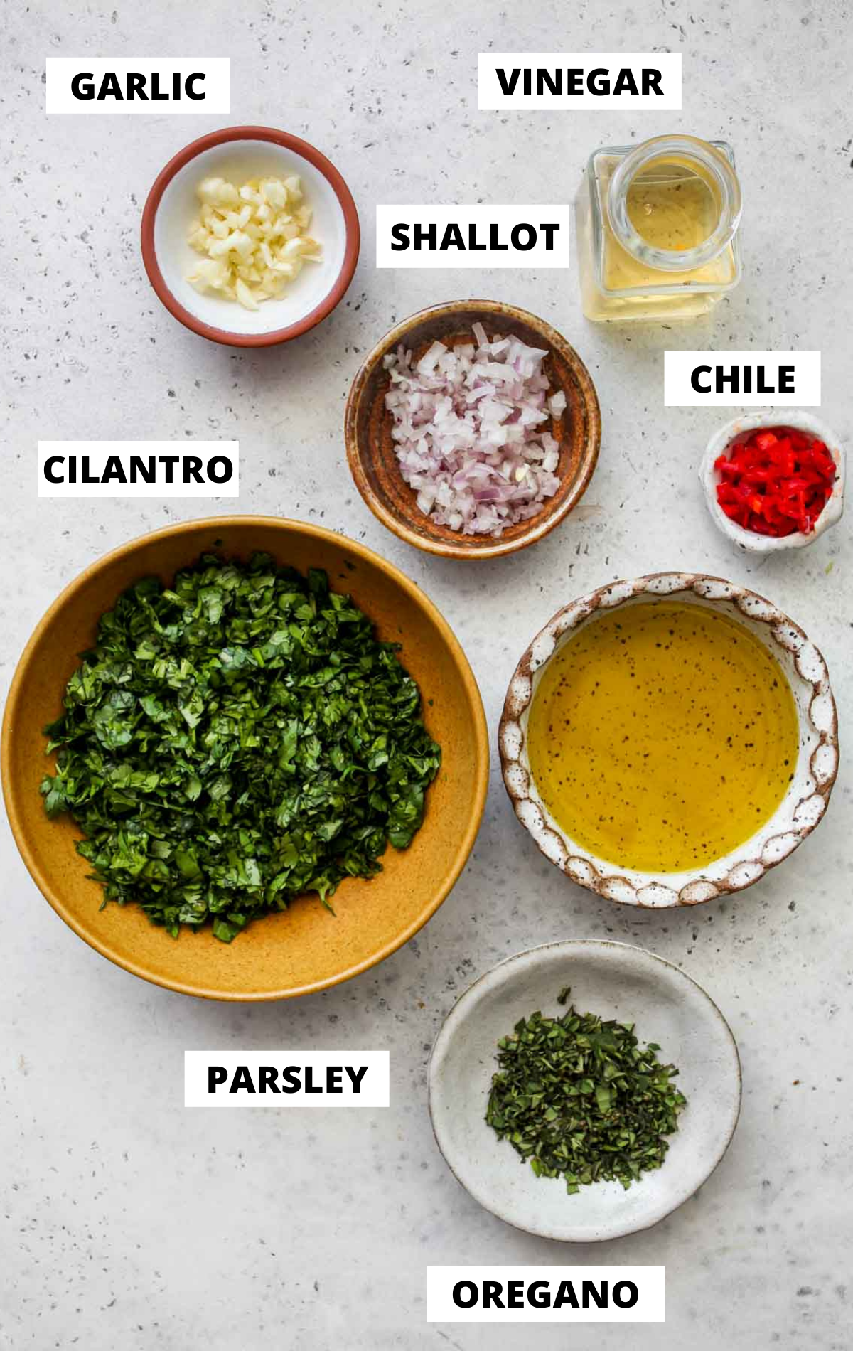 Recipe ingredients in separate bowls on a work surface with labels