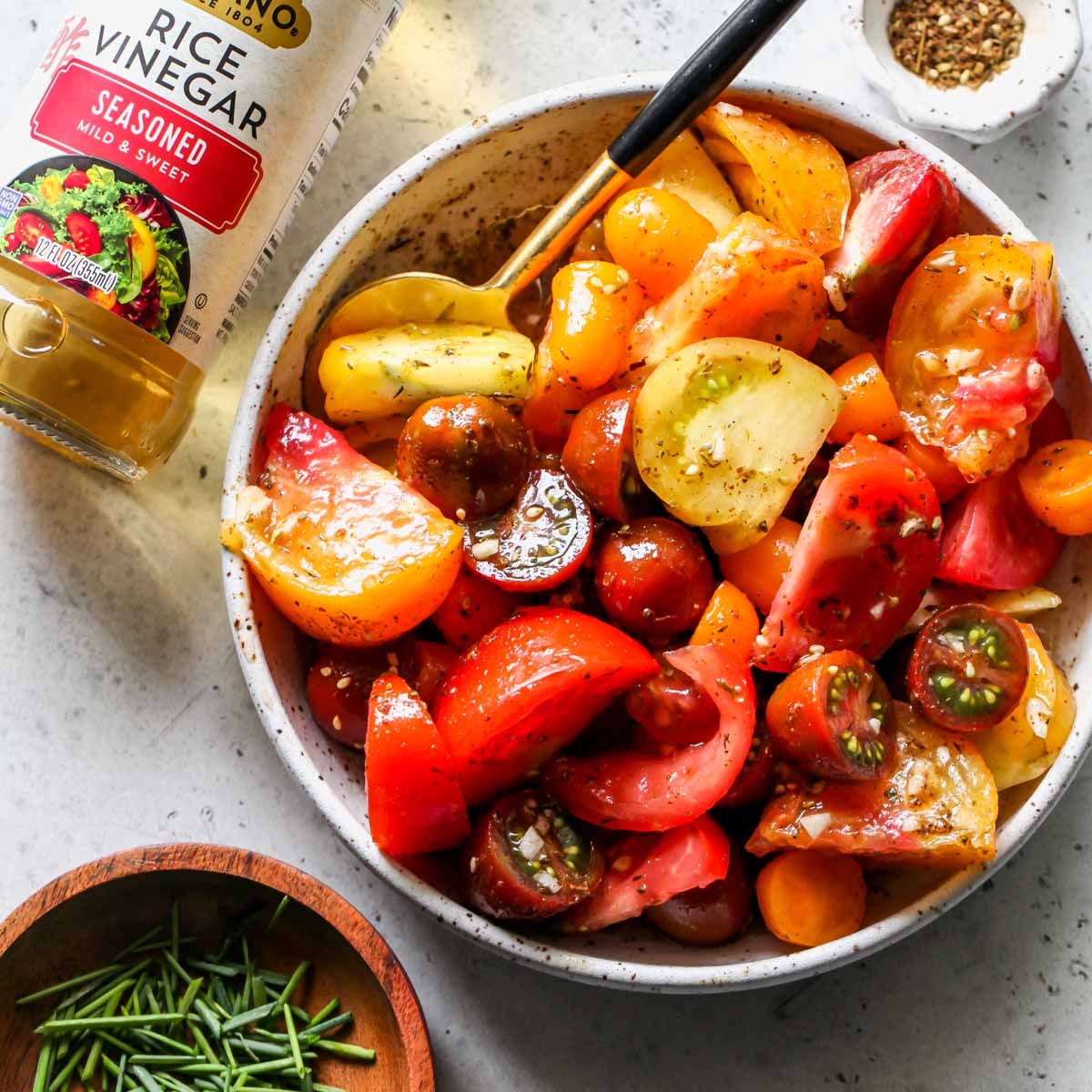 Marinated tomato salad in a white bowl