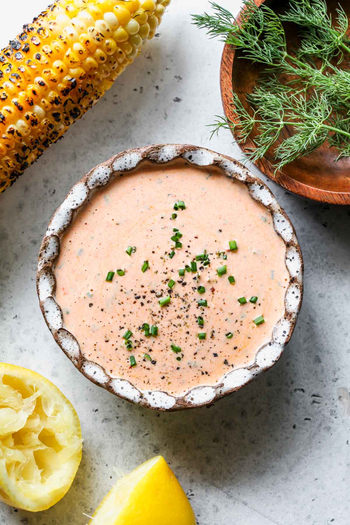 Harissa ranch dressing mixed in a small white bowl