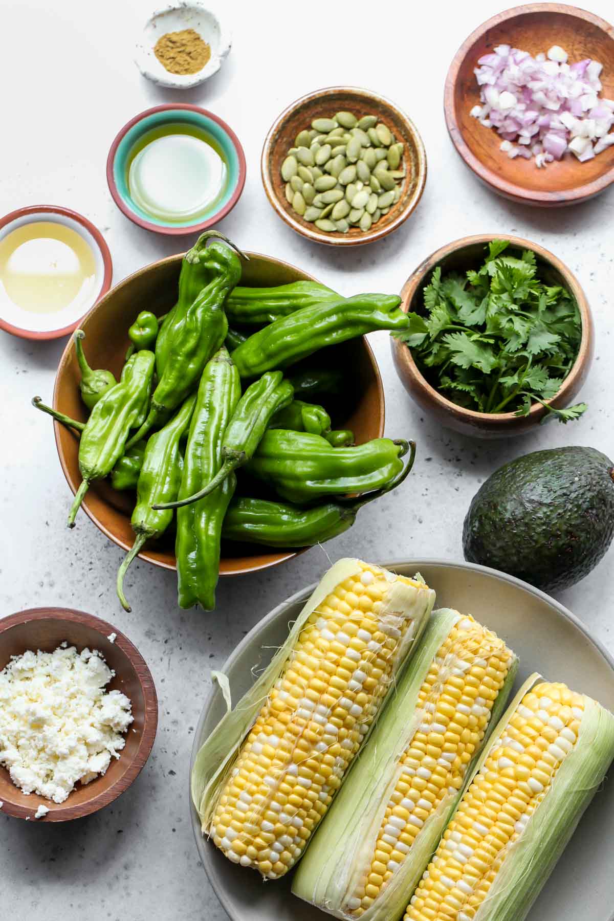 Recipe ingredients in separate bowls on a gray surface