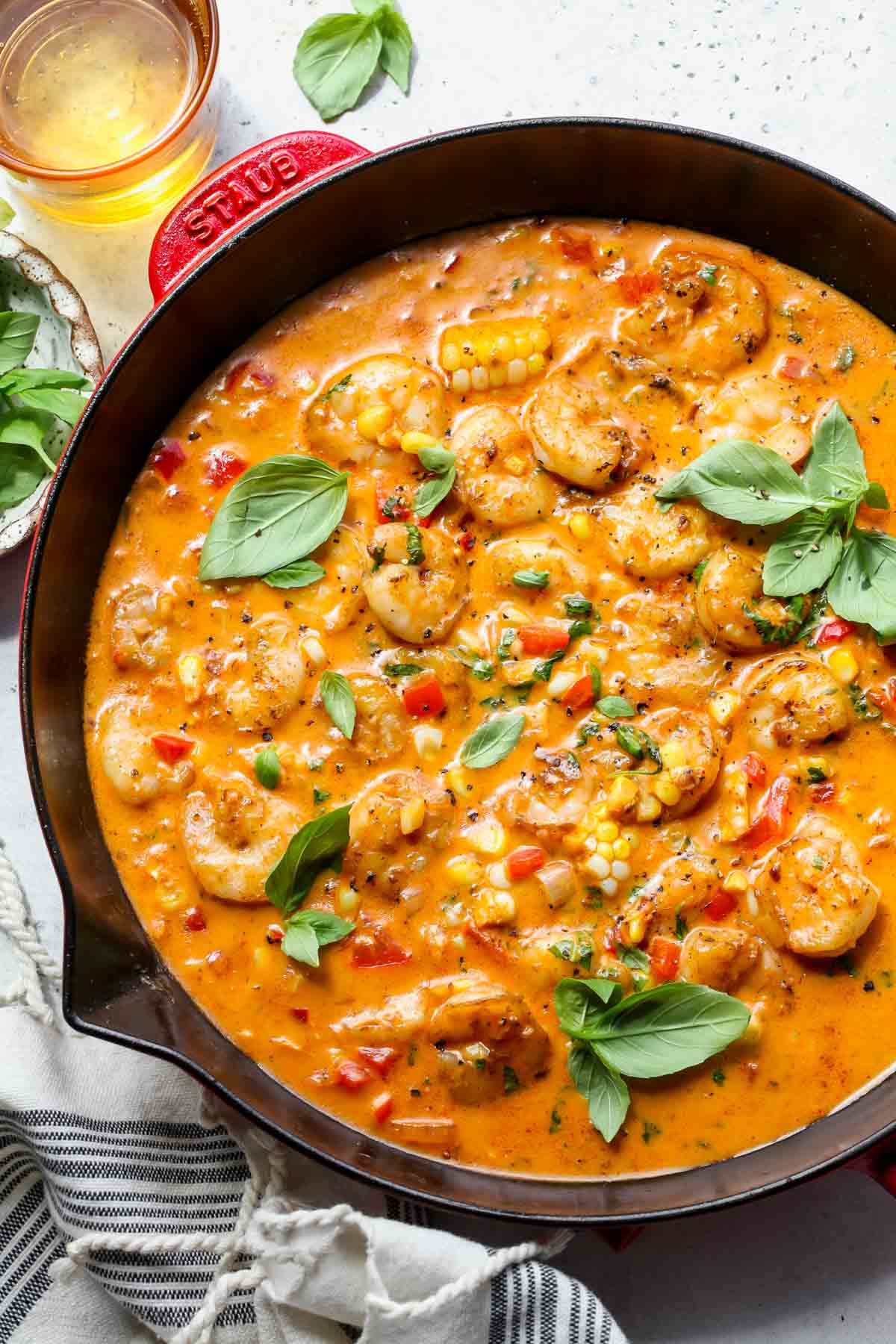 Creamy coconut shrimp skillet topped with basil leaves
