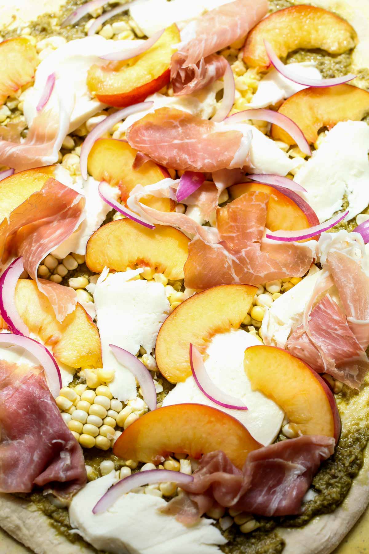 Fresh dough with toppings before going in the oven