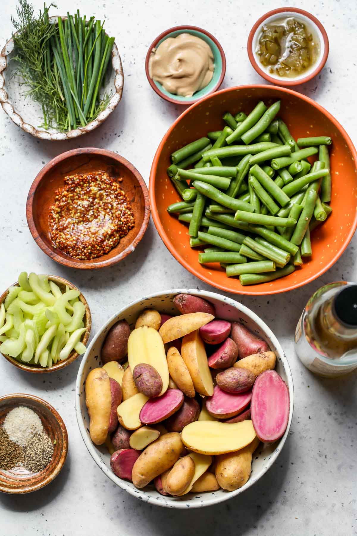 Recipe ingredients in separate bowls on a gray work surface