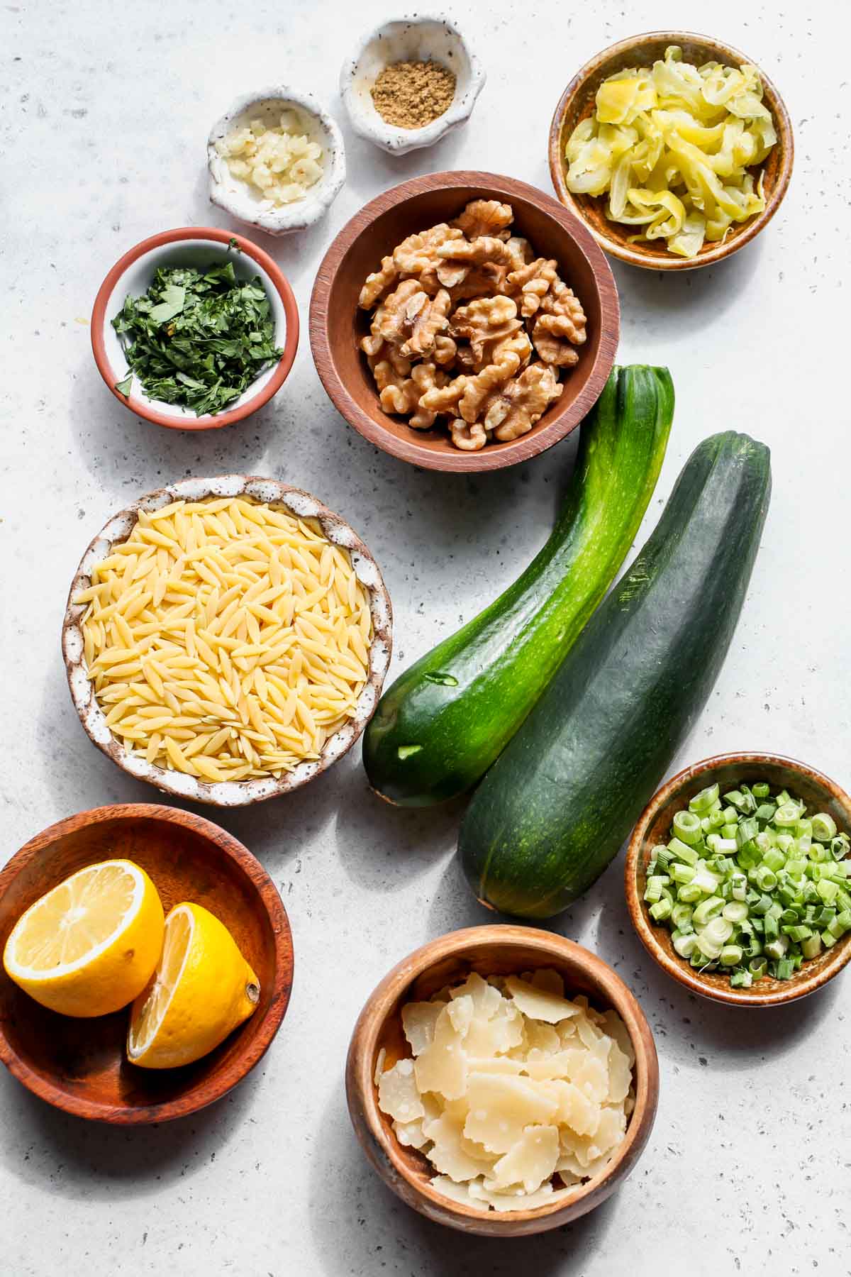 Recipe ingredients in separate bowls on a gray work surface