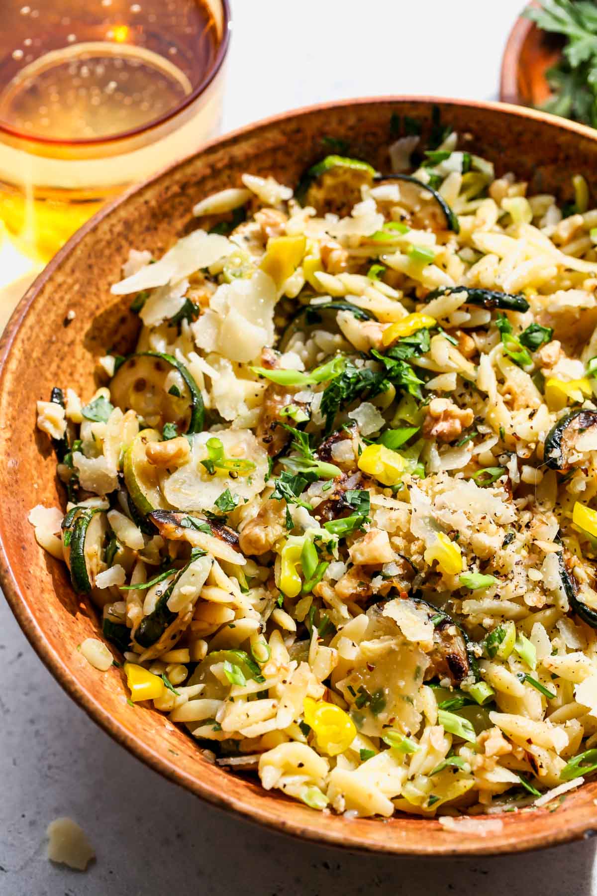Styled summer orzo salad in a serving bowl