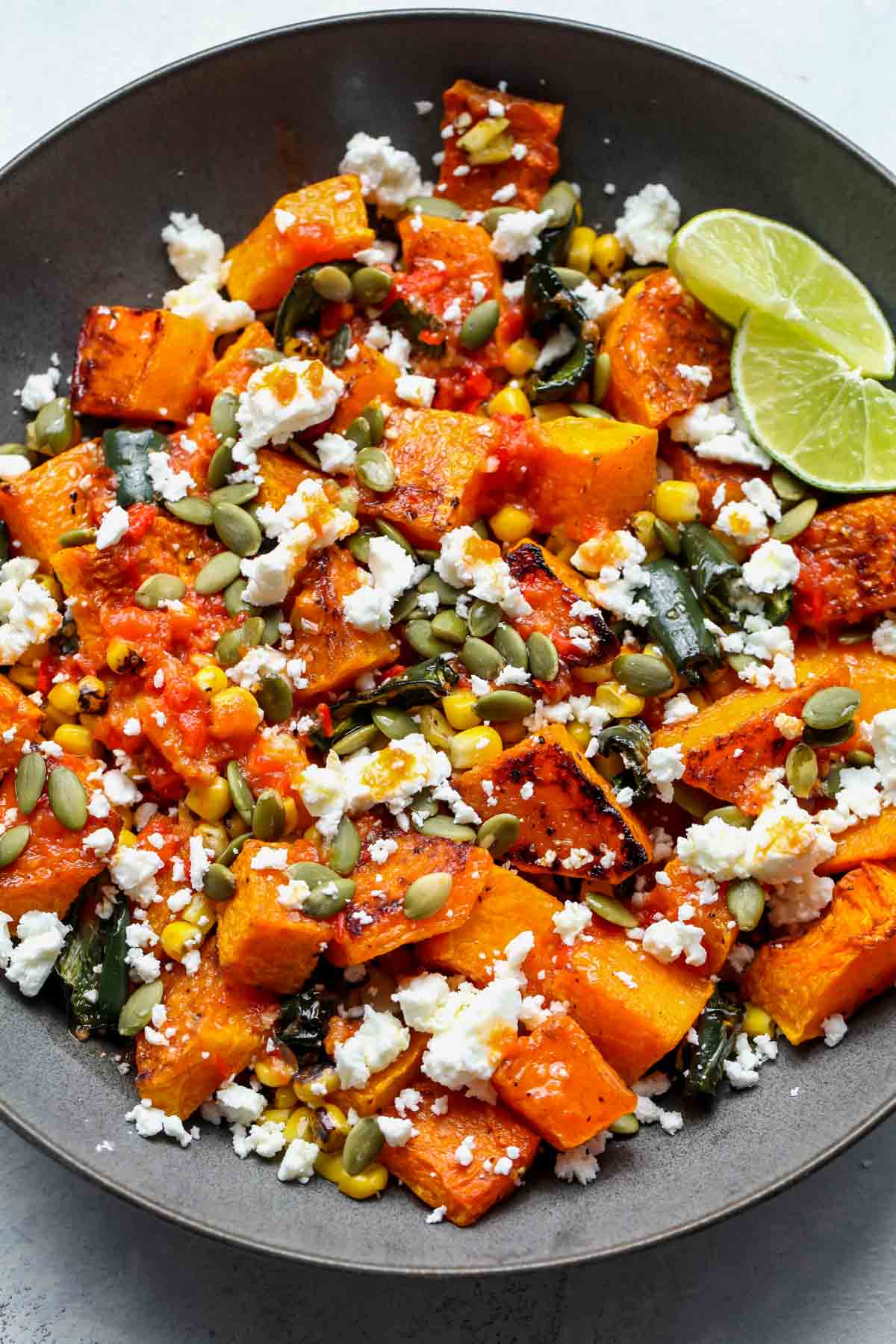 Roasted butternut squash salad with poblano, feta, and chili-lime dressing