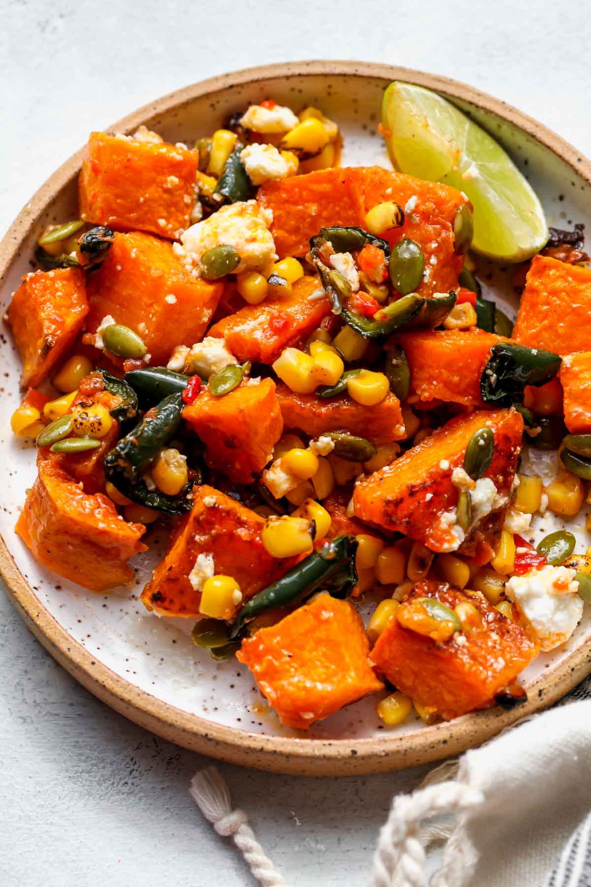 Single serving of butternut squash salad on a white plate