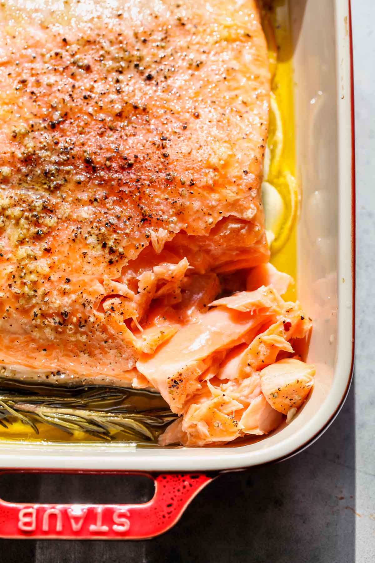 Slow-roasted salmon being flaked to see the inside