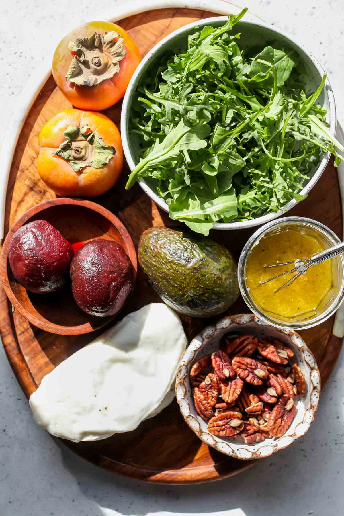 Recipe ingredients arranged on a wooden platter
