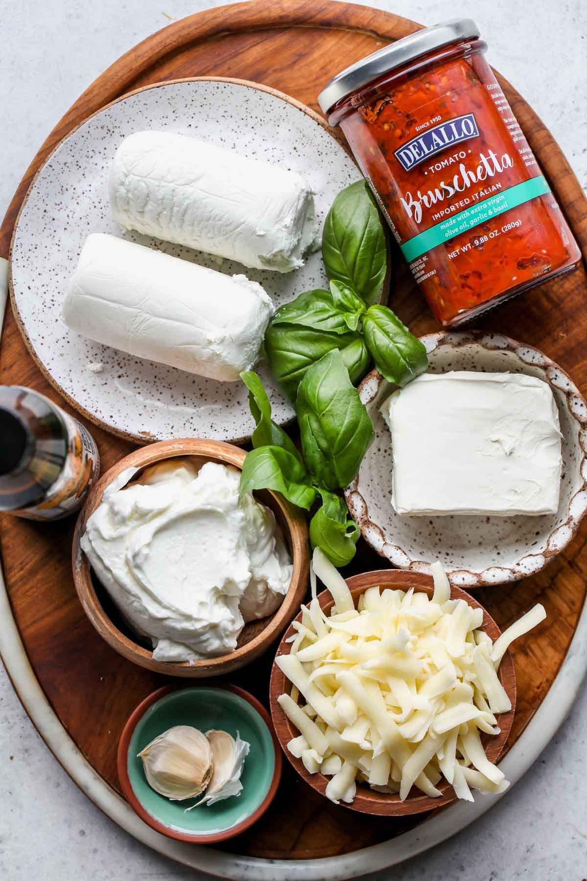 Recipe ingredients arranged on a wooden platter.