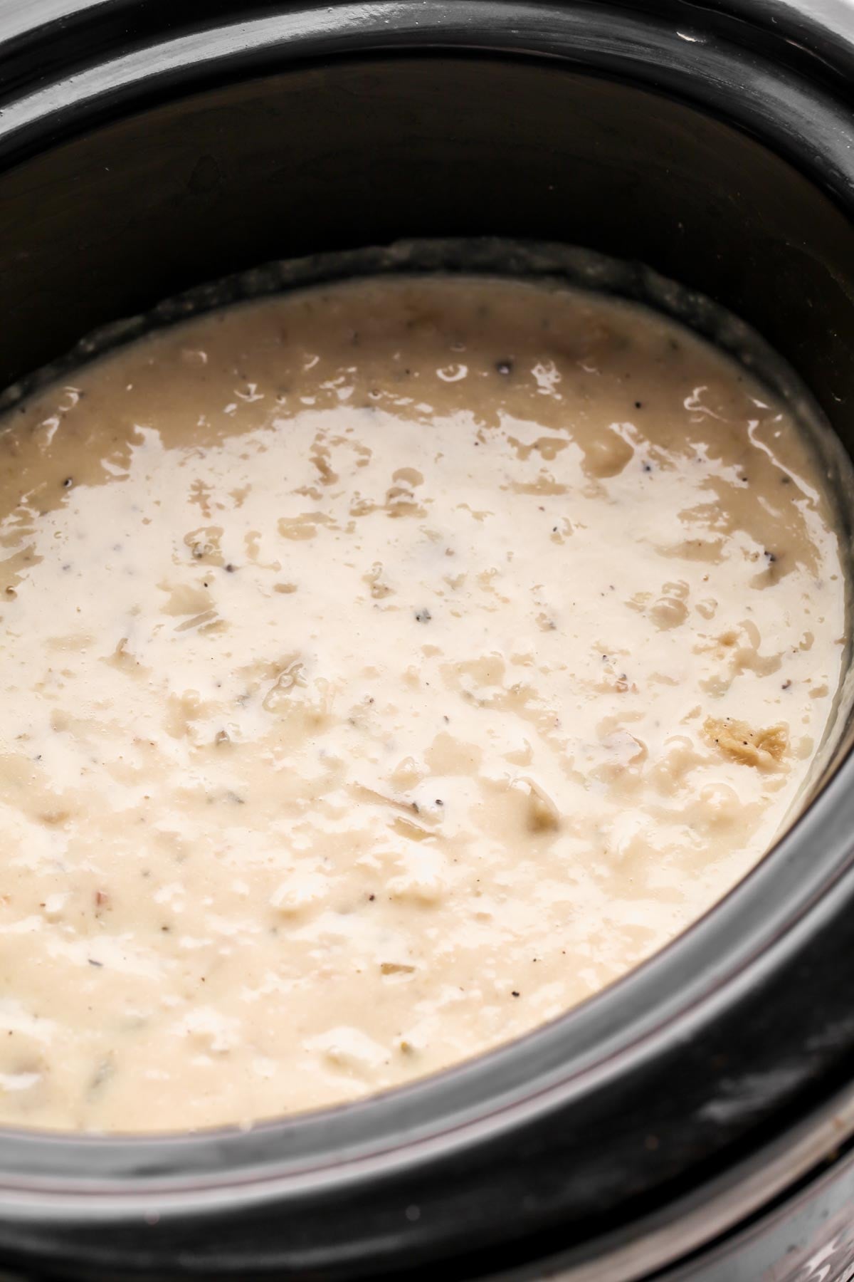 crock pot potato soup after being cooked and blended