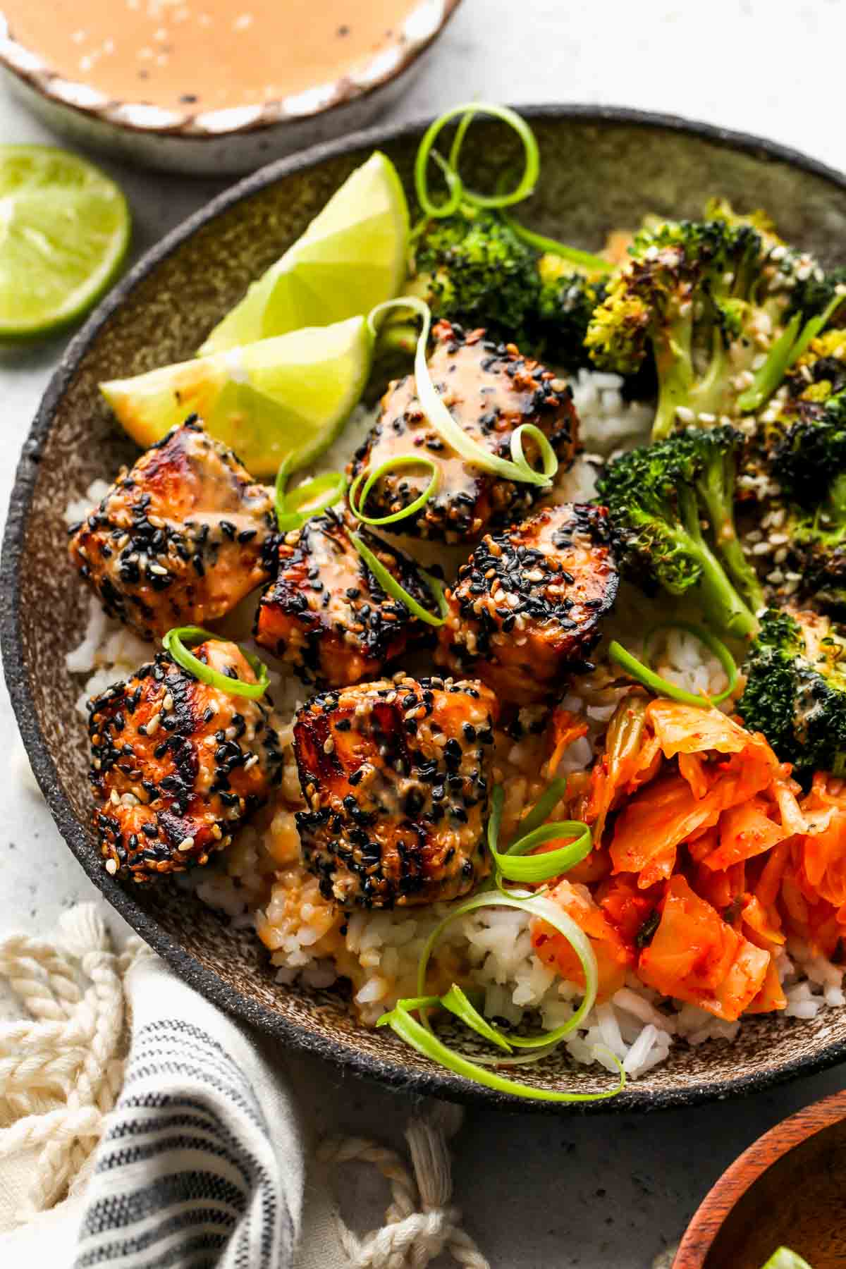 Salmon crusted salmon bowls with broccoli, kimchi, and miso sauce