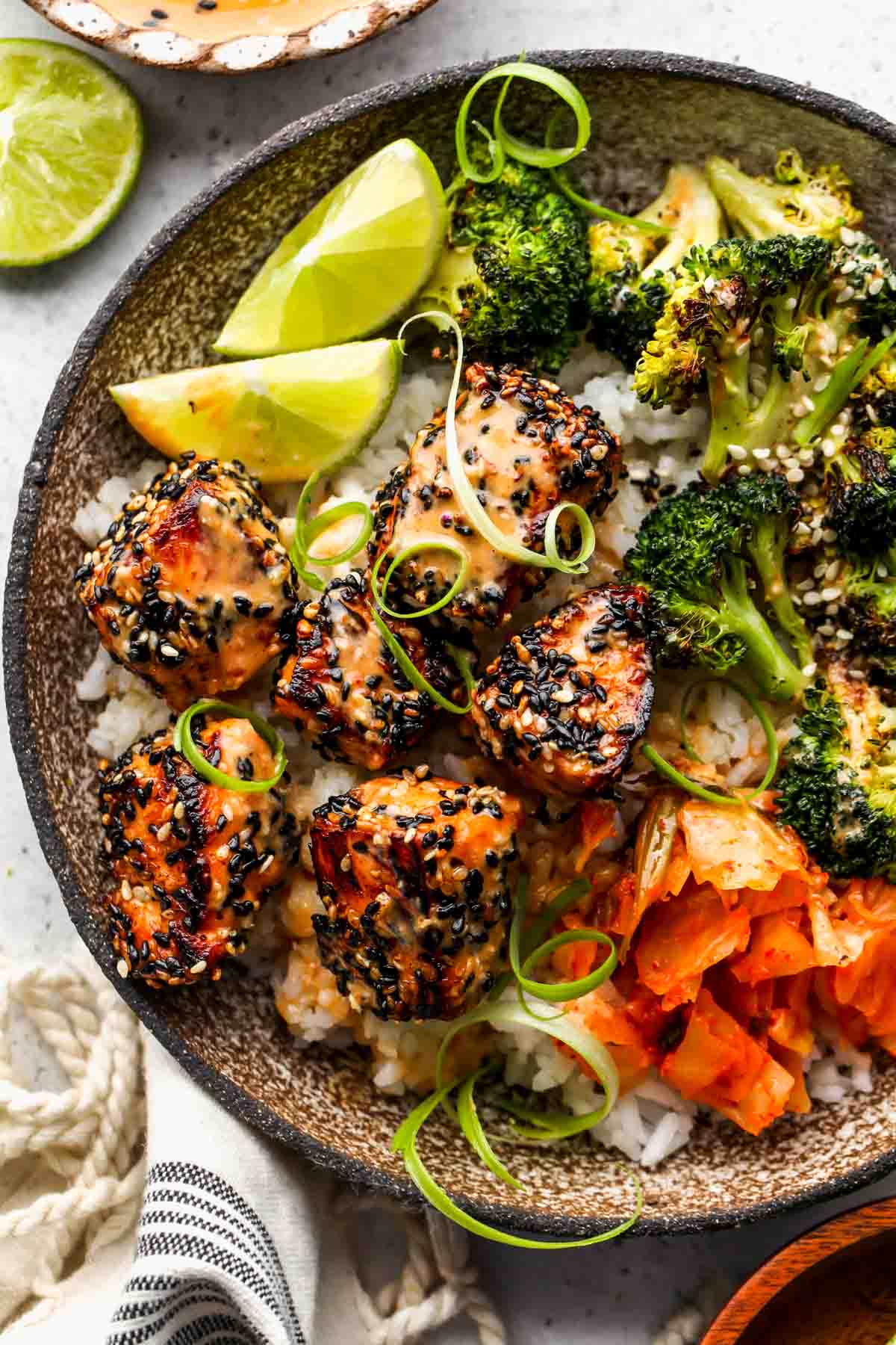 Sesame crusted salmon bowls with broccoli, kimchi, and miso sauce