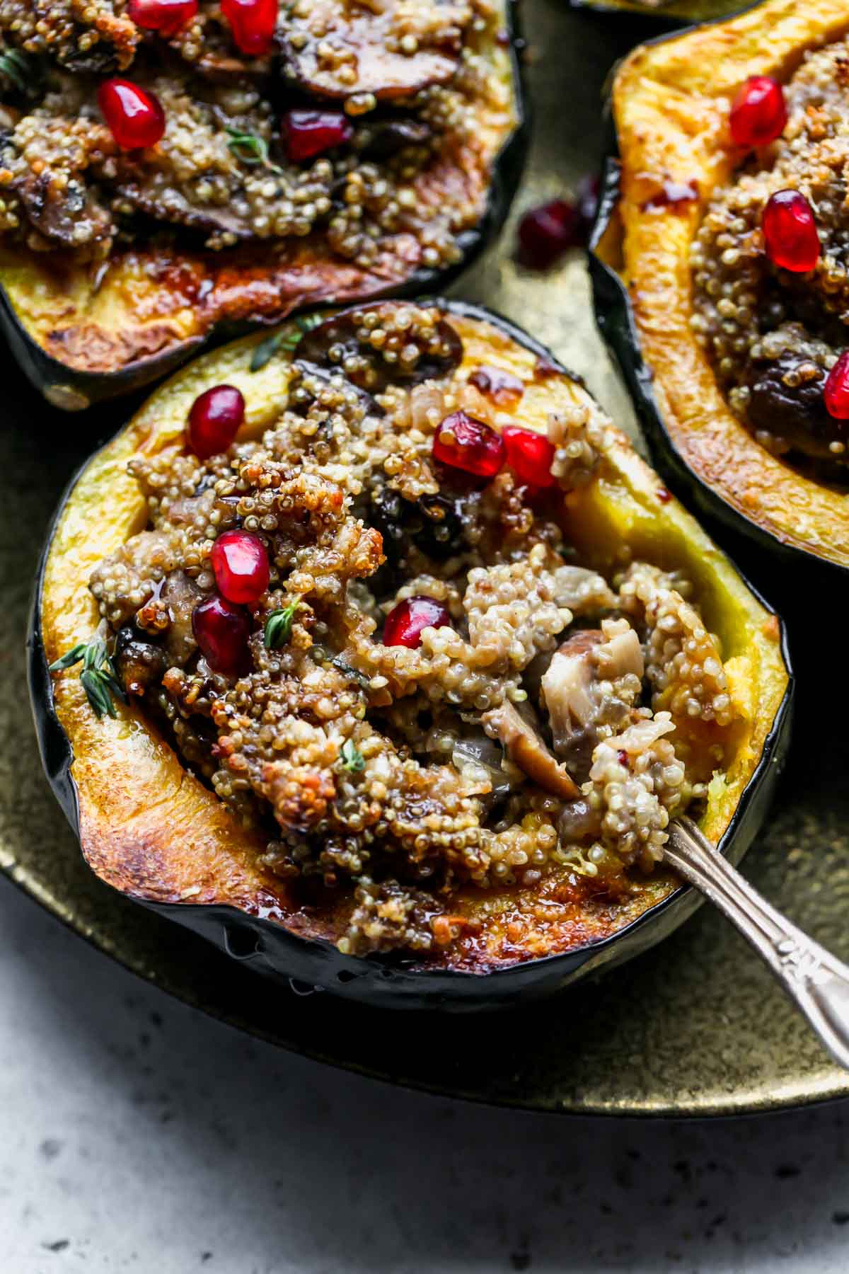 A fork digging into mushroom quinoa mixture