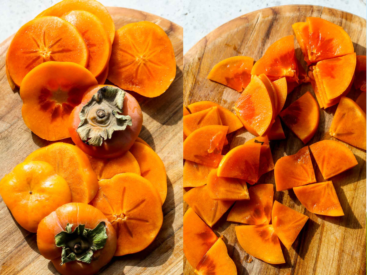 Persimmons being sliced on a wooden cutting board