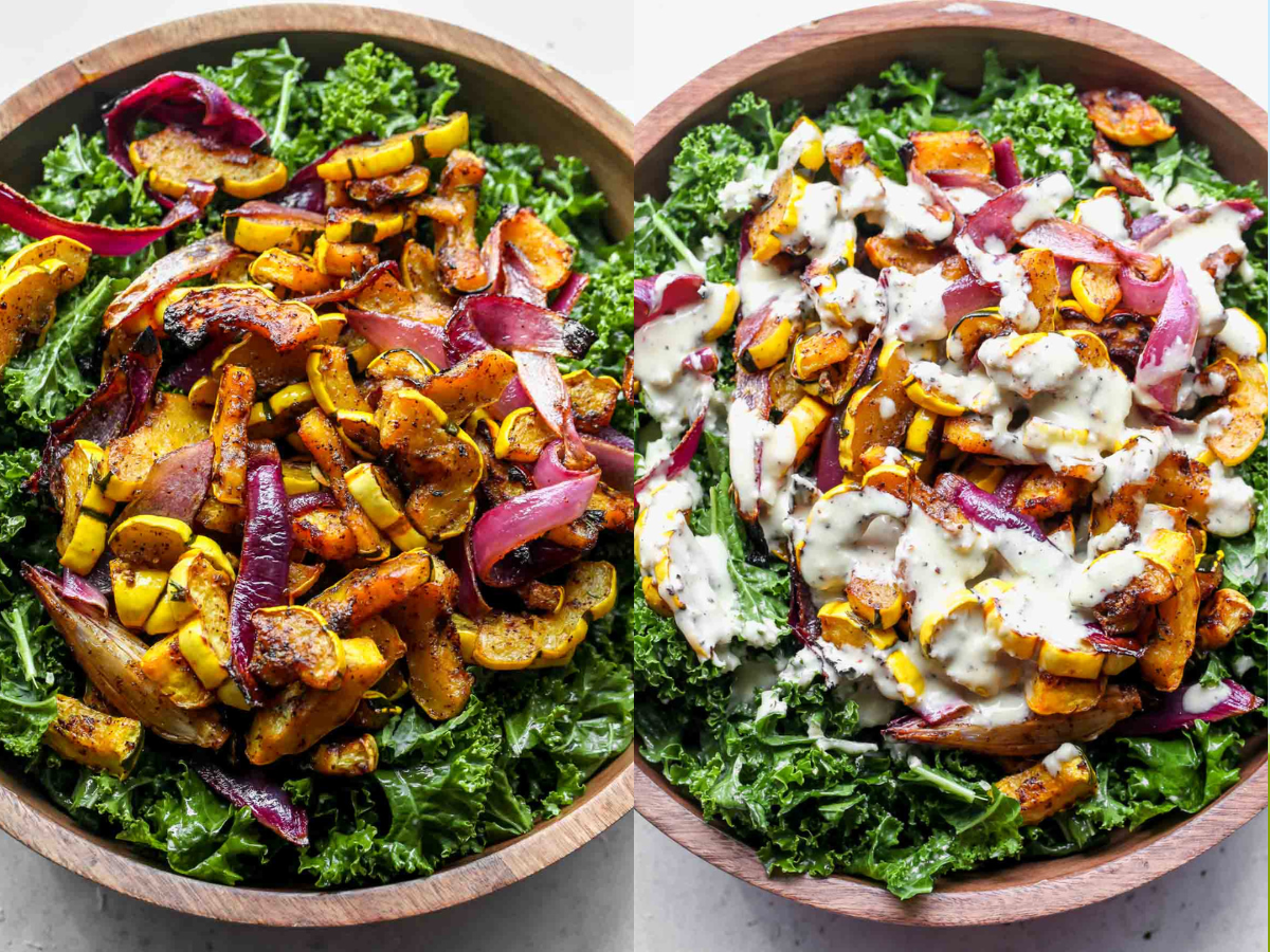 Kale, roasted veggies, and dressing being assembled in a wooden bowl