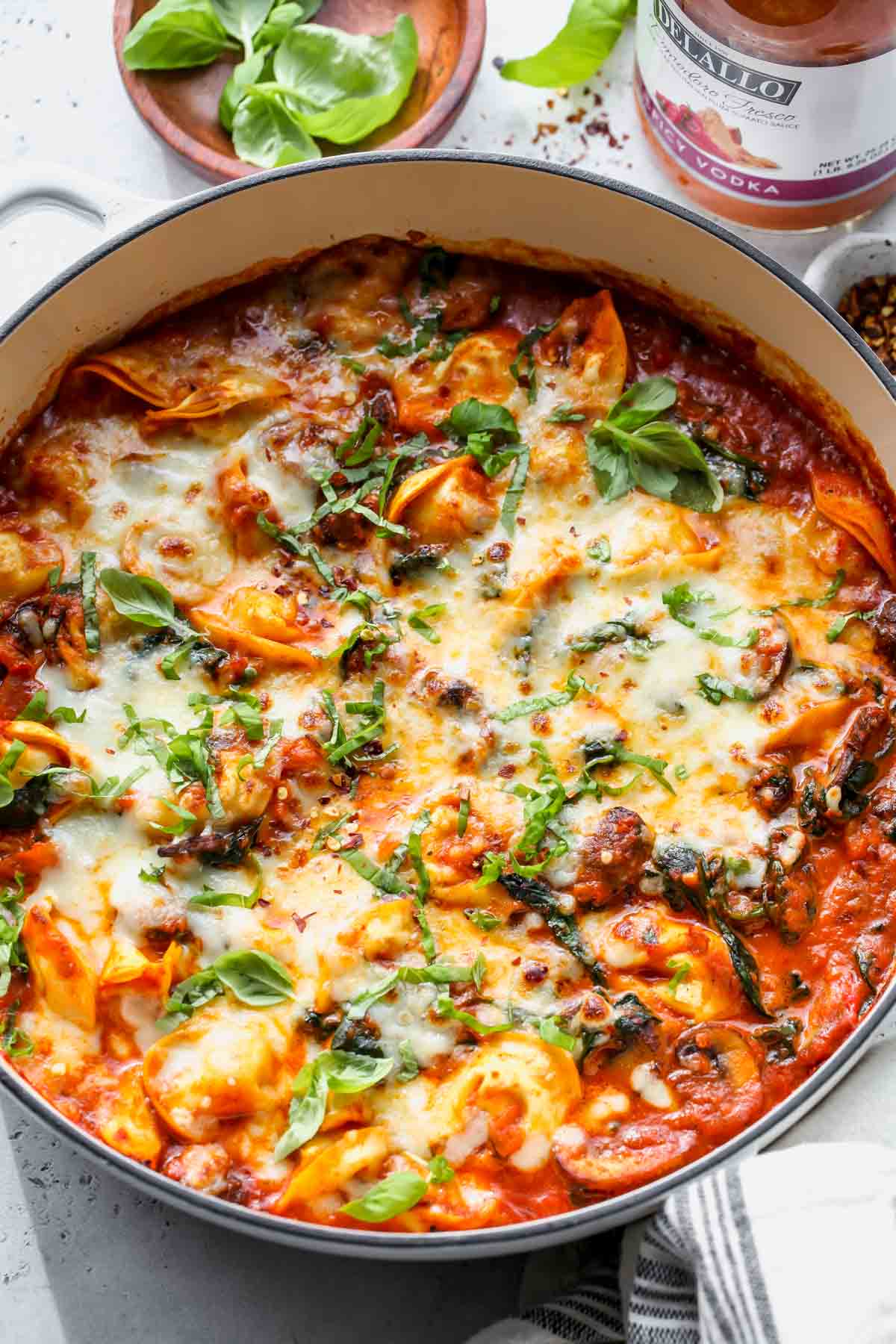 Baked cheese tortellini in vodka sauce styled in a white pot