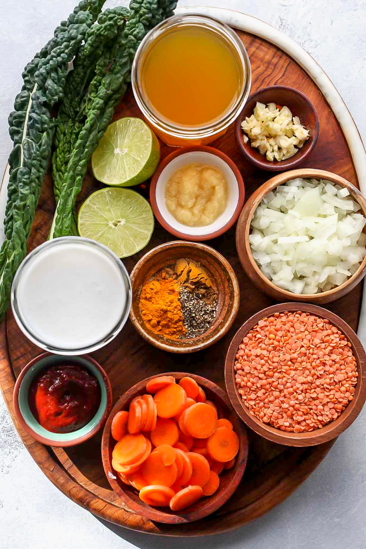 Recipe ingredients arranged on a wooden serving platter