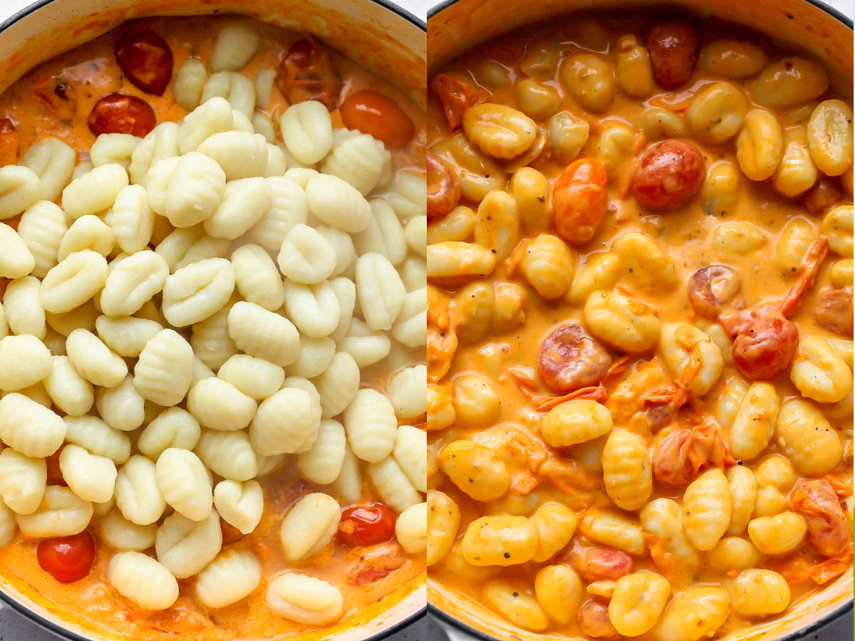 Cooked gnocchi being added to tomato cream sauce in a white pan.