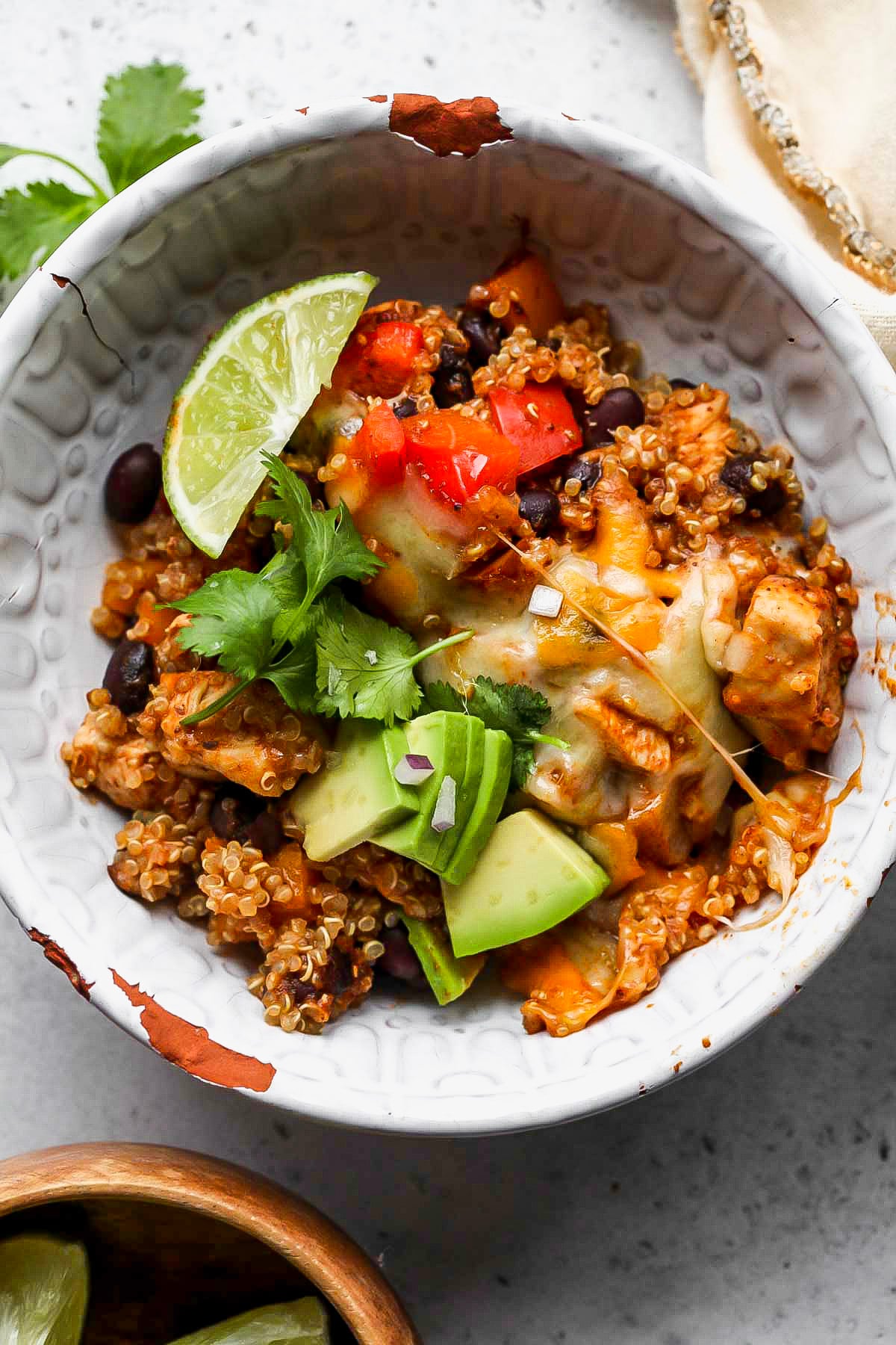 Single serving of quinoa enchilada casserole in a white bowl.