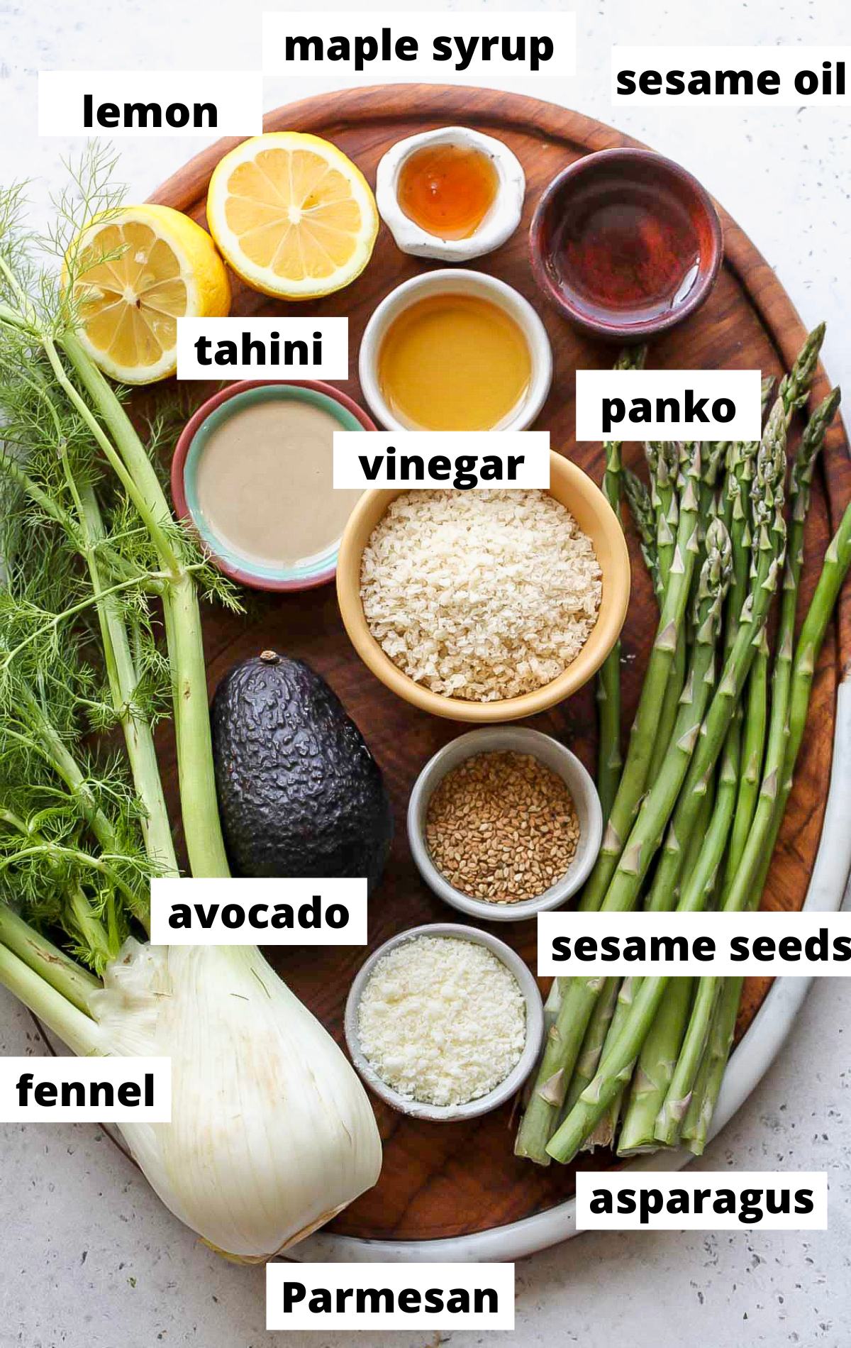 Recipe ingredients arranged on a wooden board with labels.