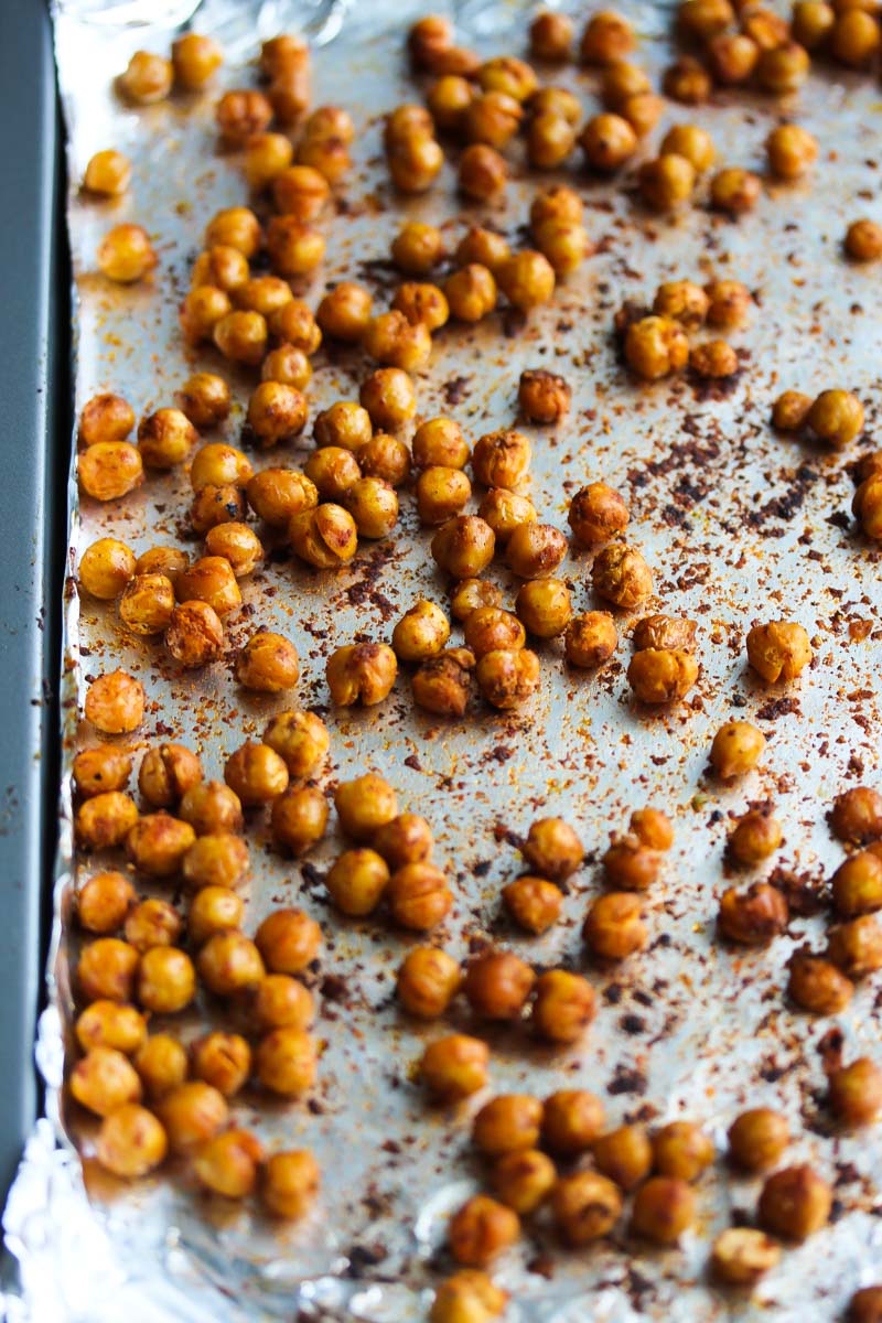 Crispy spiced chickpeas on a baking sheet.