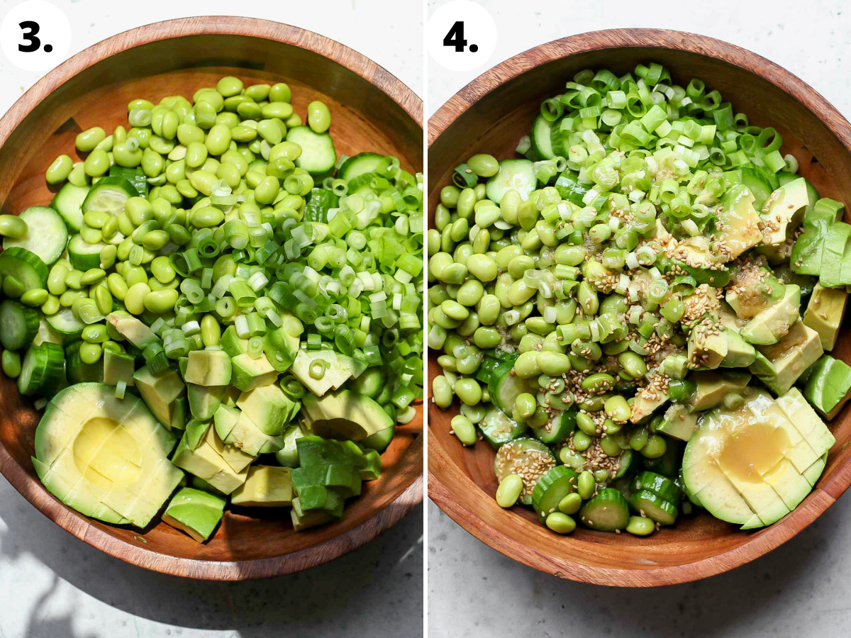 cucumber, edamame, avocado, and green onion being tossed in dressing in a large wooden bowl.