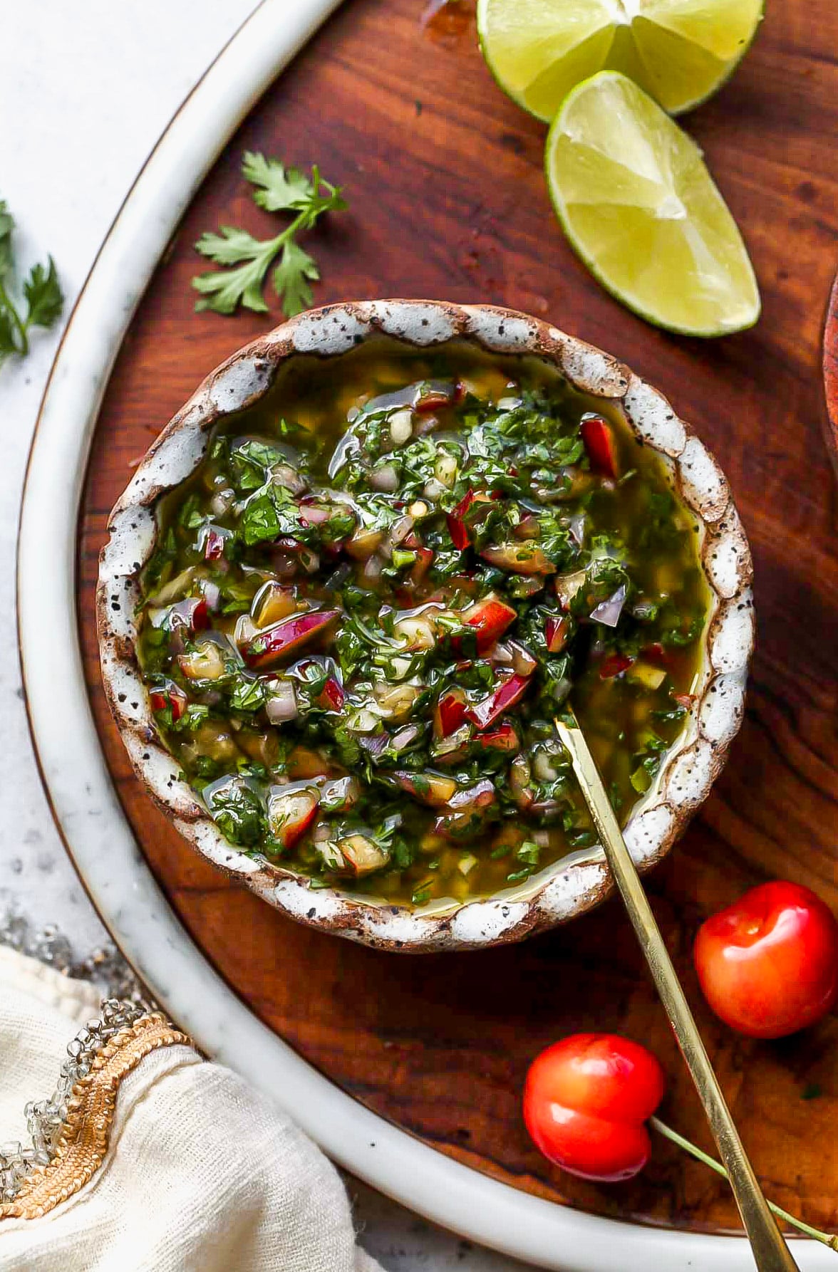 Cherry chimichurri sauce in a small white bowl.