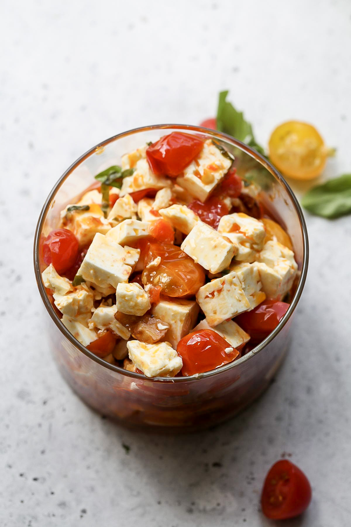 Marinated feta in a glass jar.