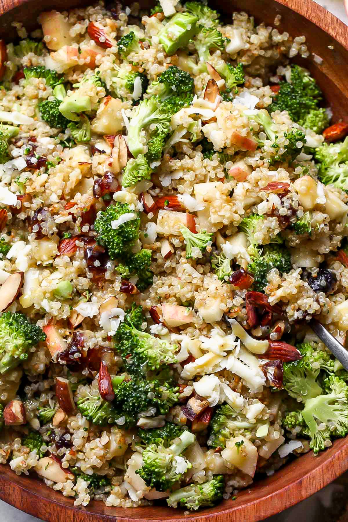 Broccoli-cheddar quinoa salad in a wooden bowl.