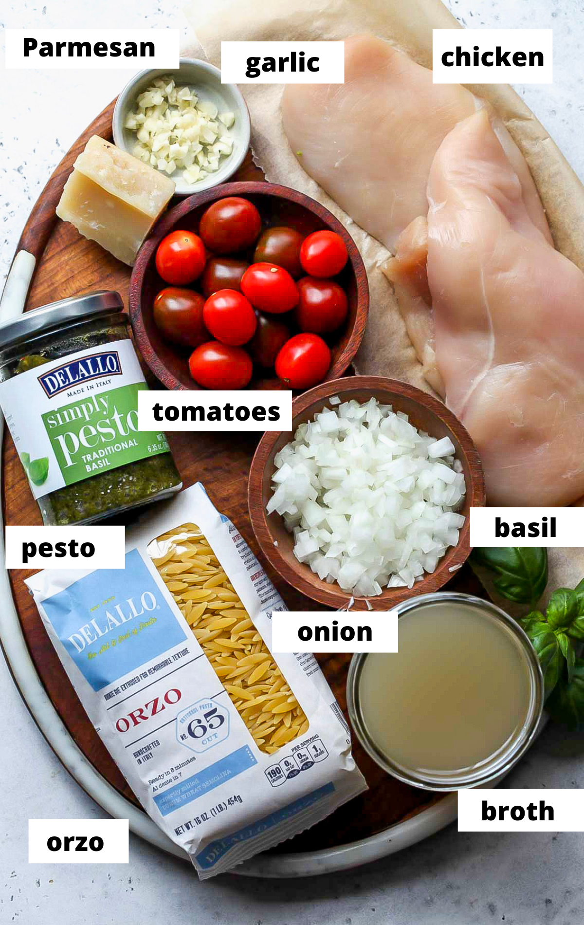 Recipe ingredients arranged on a wooden platter with labels.