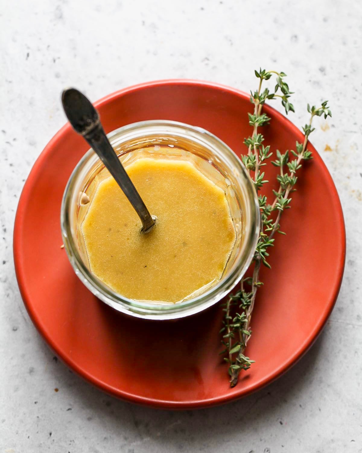 Maple-mustard dressing in a glass jar.