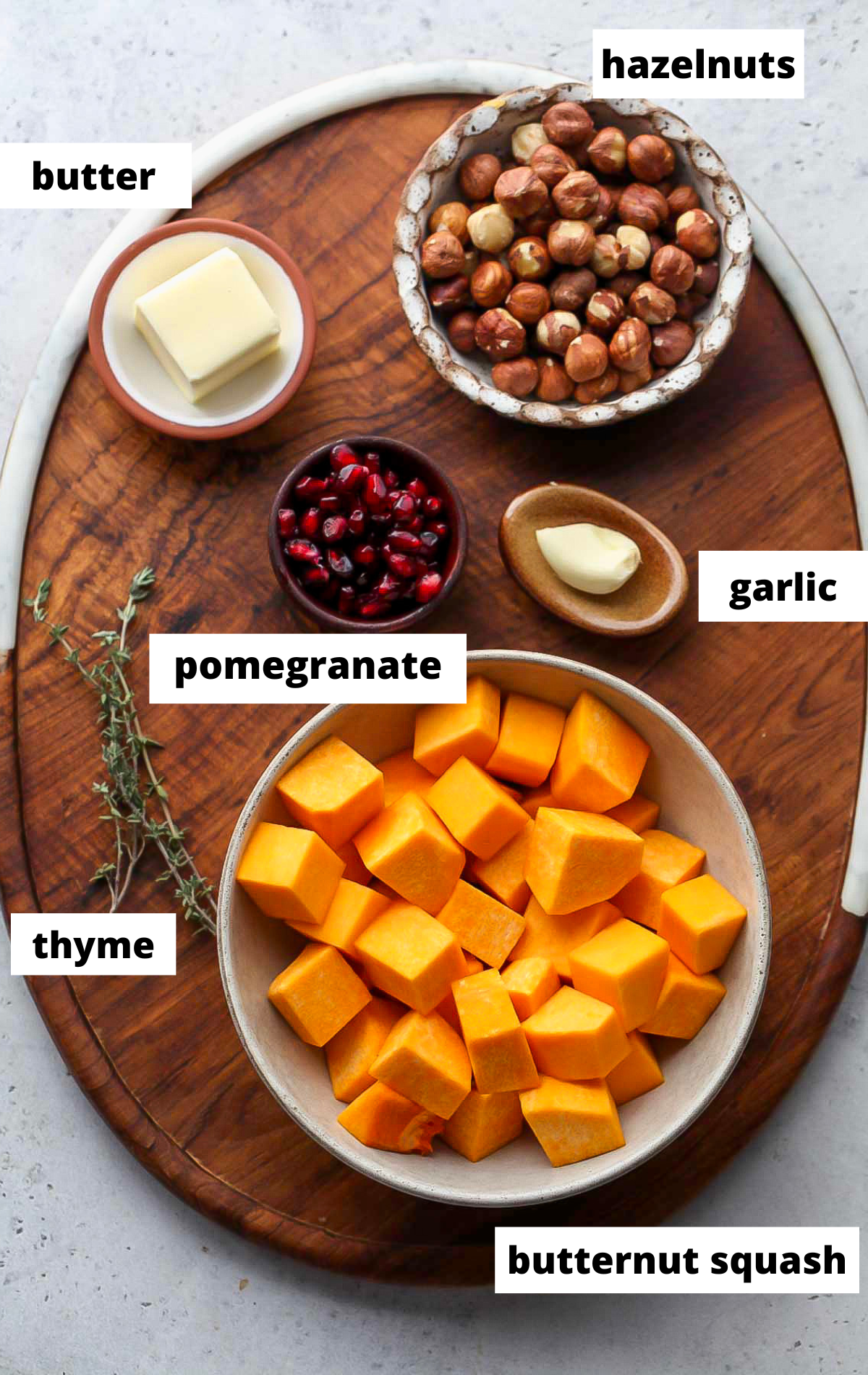 Recipe ingredients arranged on a wooden board with labels.