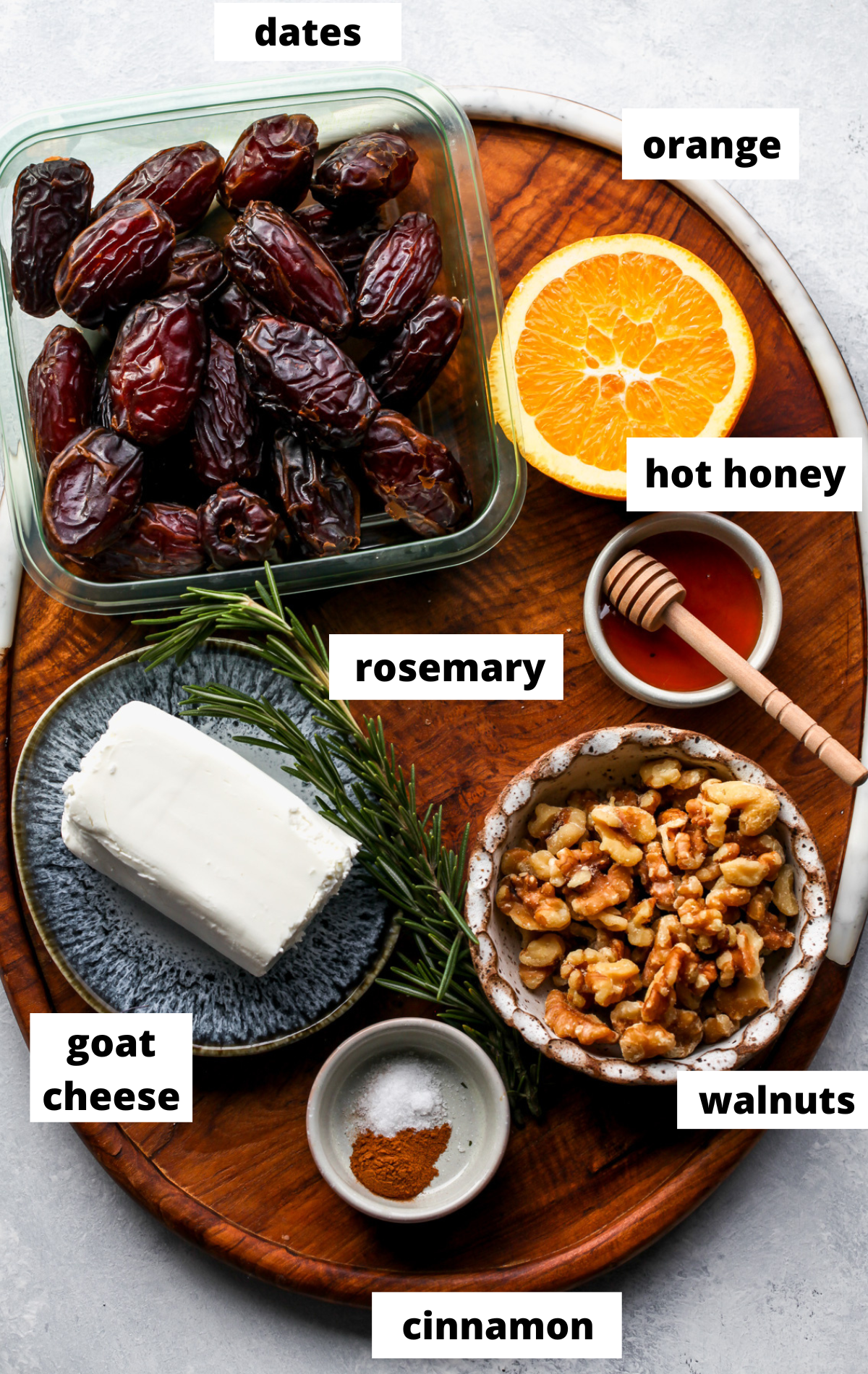 Recipe ingredients arranged on a wooden platter with labels.