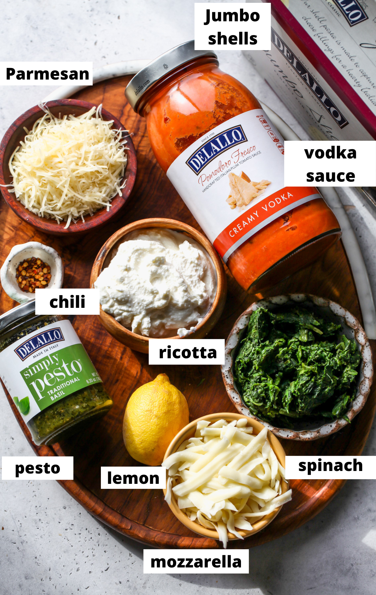 Recipe ingredients arranged on a wooden board with labels.